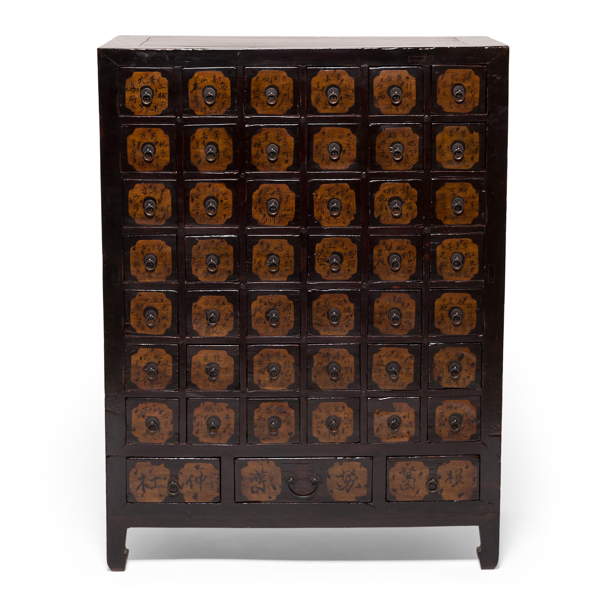 It is unusual to find a pair of 19th century Chinese apothecary chests that have remained together during the past century. Cabinets like this were originally used by doctors to organize and store herbal medicines. Each of the chests has 46 drawers