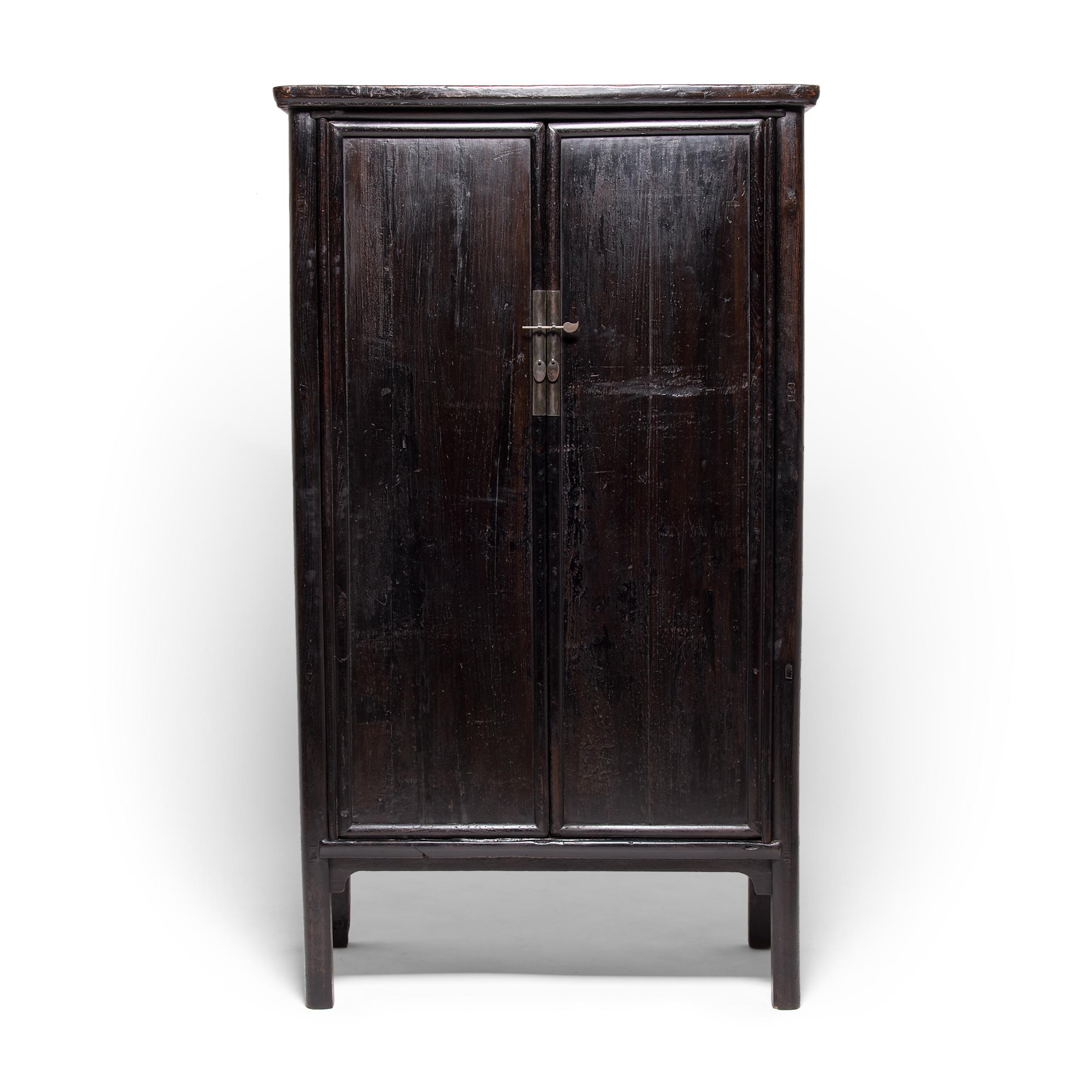 Created in China's Shanxi province, these striking, early 19th-century cabinets take their name from their elegant, rounded wood frames. Austere in their simplicity, the cabinets honor Ming furniture design with clean lines and even finishes,
