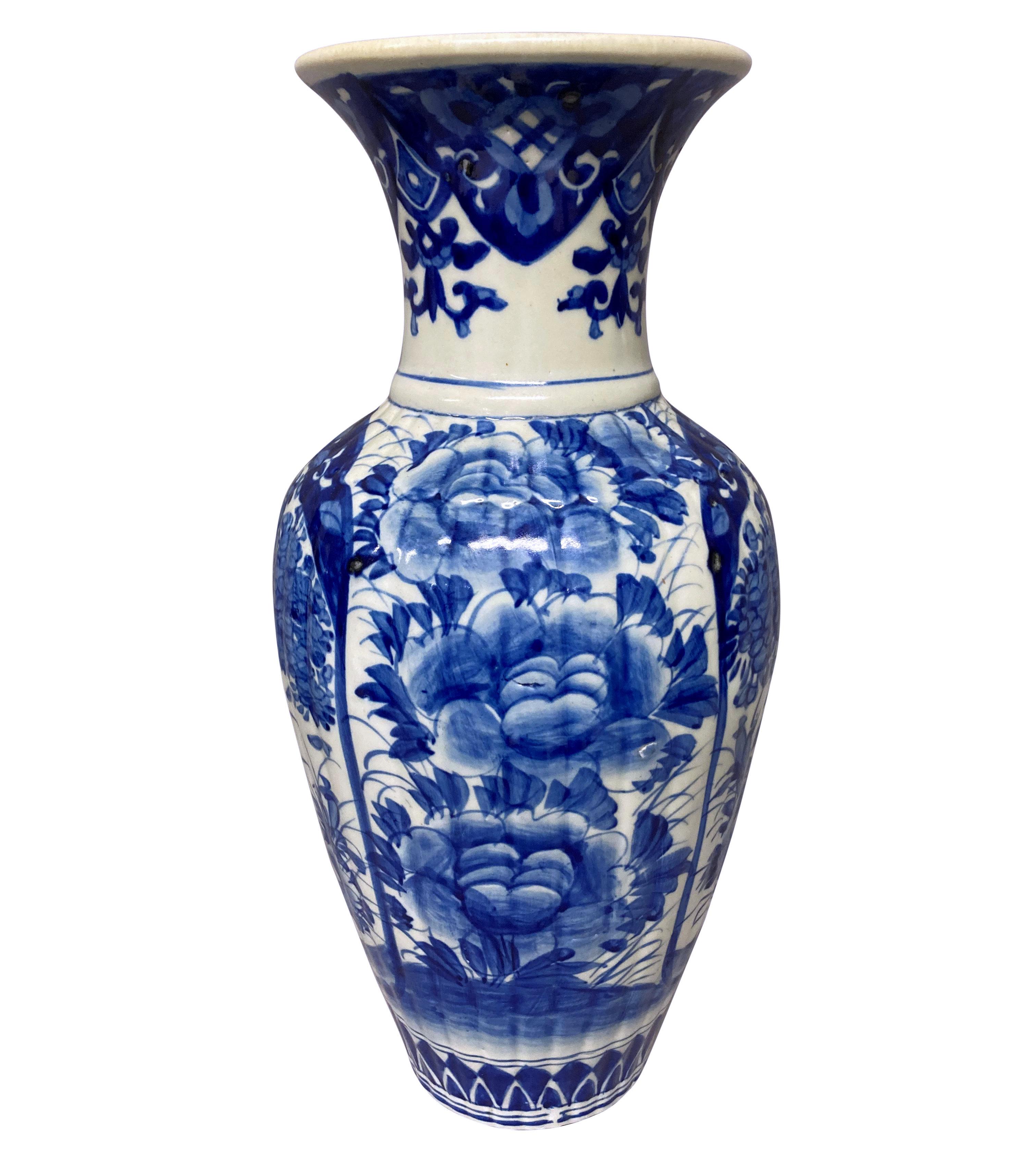 A pair of good scale late XIX Century Chinese export blue and white baluster vases. Decorated throughout with peonies, peacocks and foliage. In very good condition apart from a small historic chip to one rim.