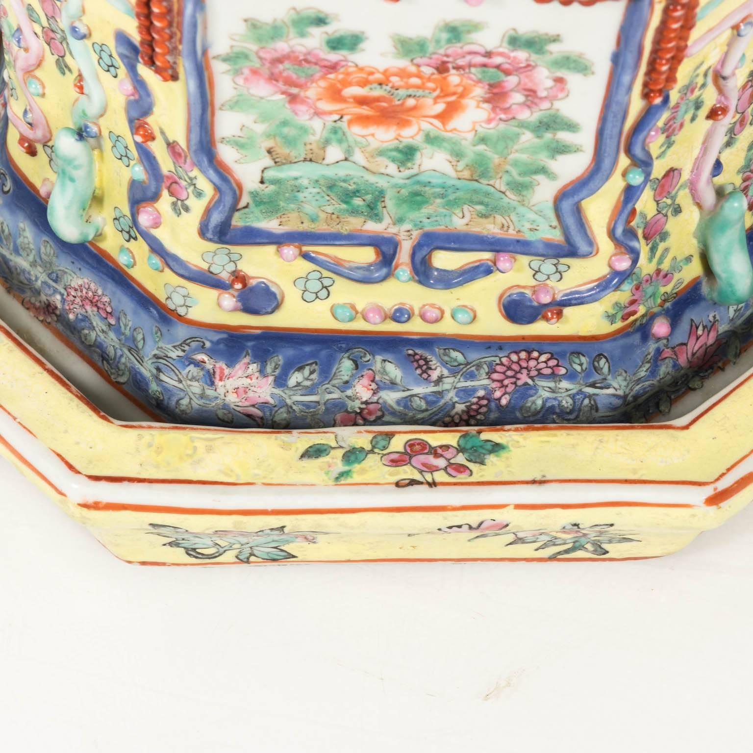 19th century Chinese painted cachepots with Chinese figures, floral motifs, and matching detachable bases.