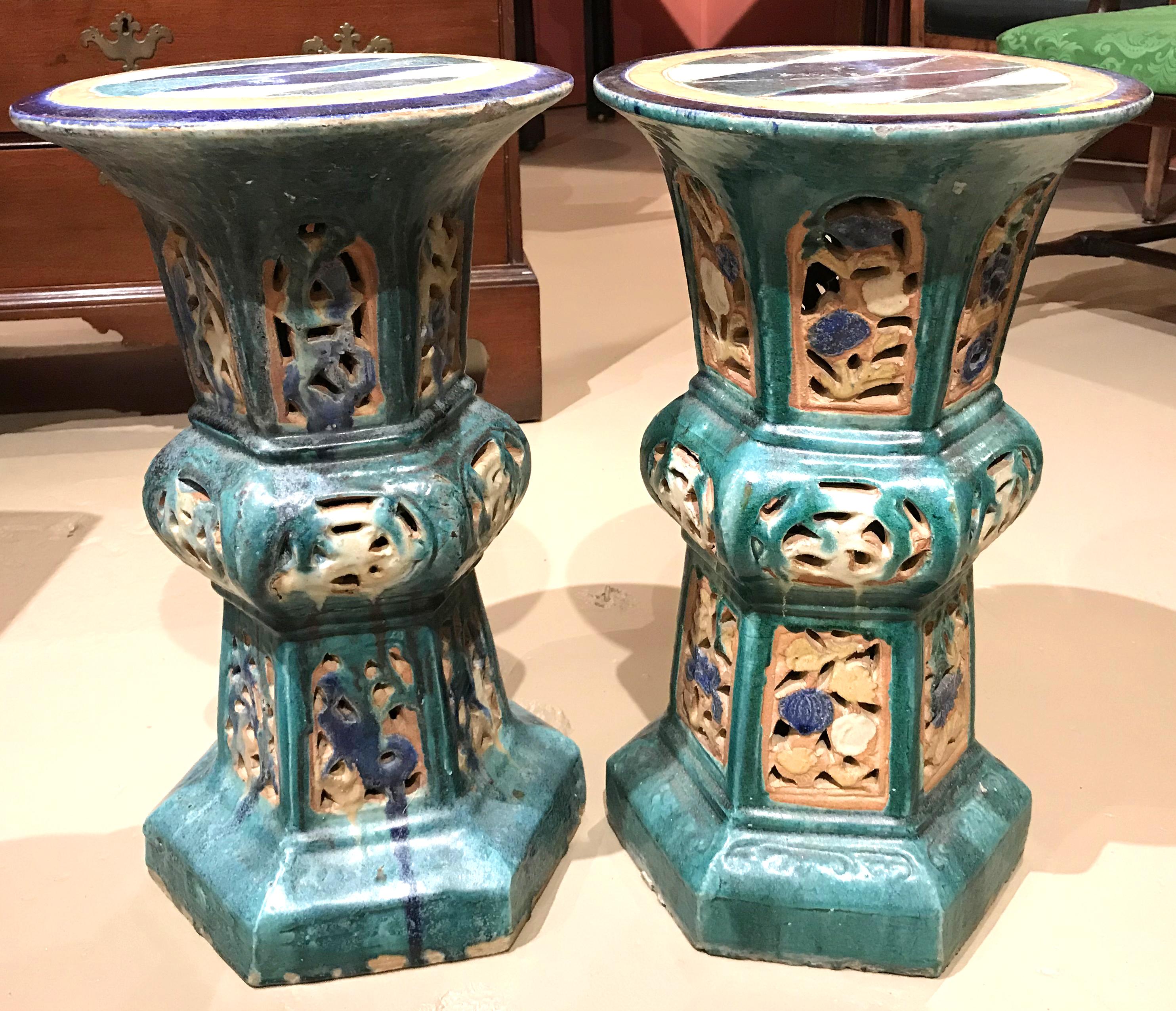 A fine pair of polychrome ceramic reticulated garden pedestals or stands with hexagonal bases, 19th century Chinese, in very good overall condition, with minor edge losses, and expected wear from age and use. Dimensions: 21 in height x 12 in