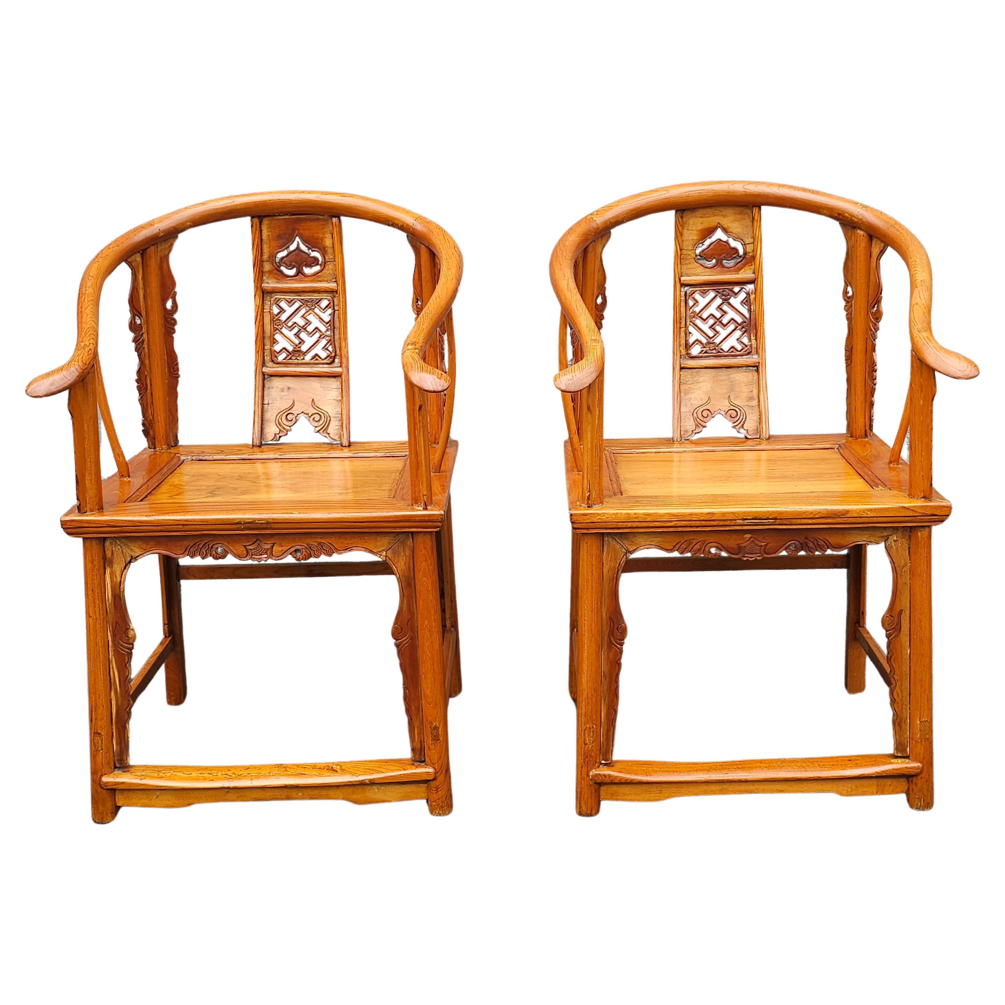 19th Century Pair Of Chinese Elmwood Horseshoe-Back Armchairs in good antique condition. Measure 25