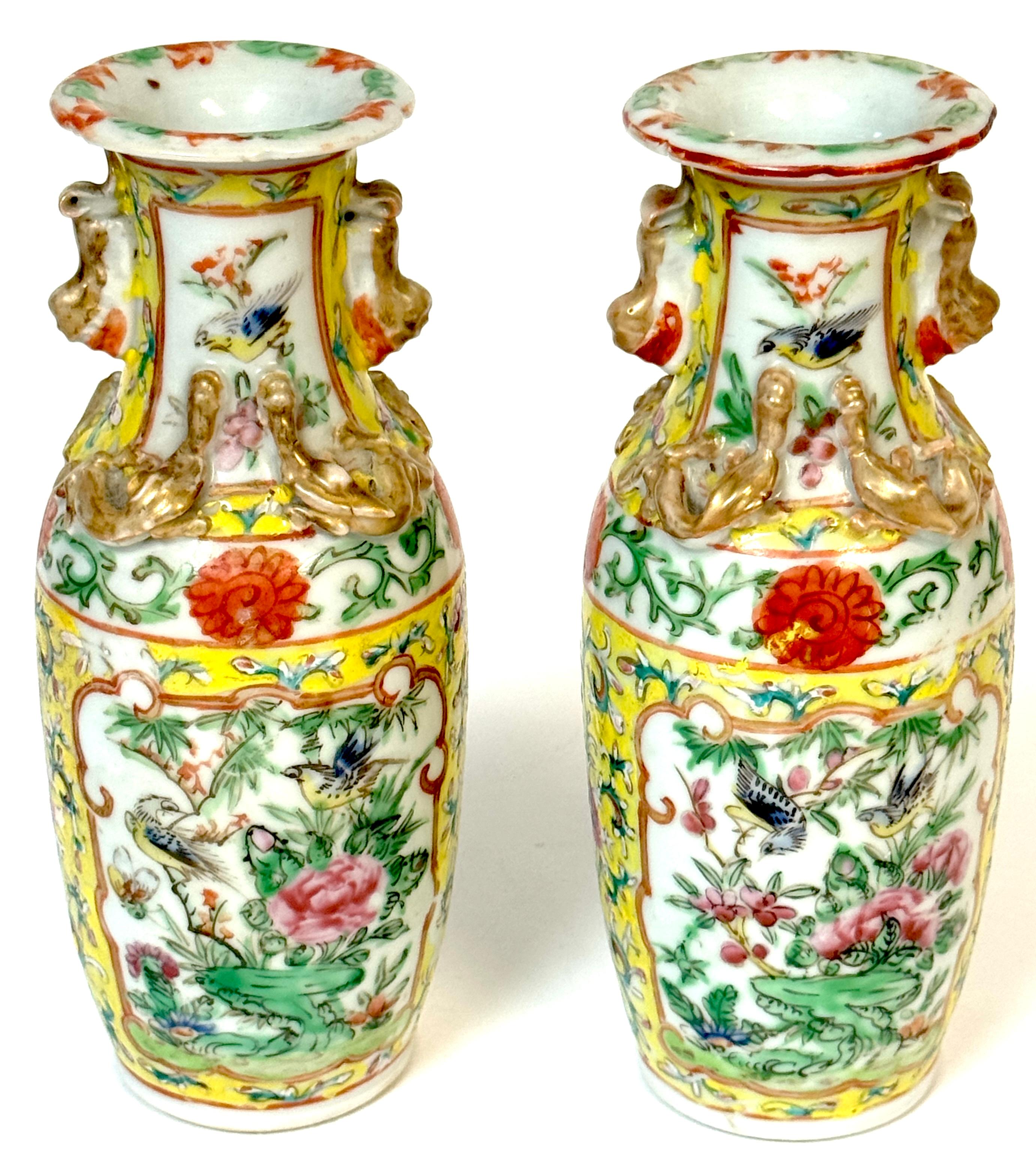 Pair of 19th Century Chinese Export Famille Rose Vases with Gilt Foo Lion Handles
China, Qing Dynasty, circa 1880
Dimensions: 7.75” high × 3” diameter × 2.5” base diameter

A vibrant and finely detailed pair of 19th century Chinese export porcelain
