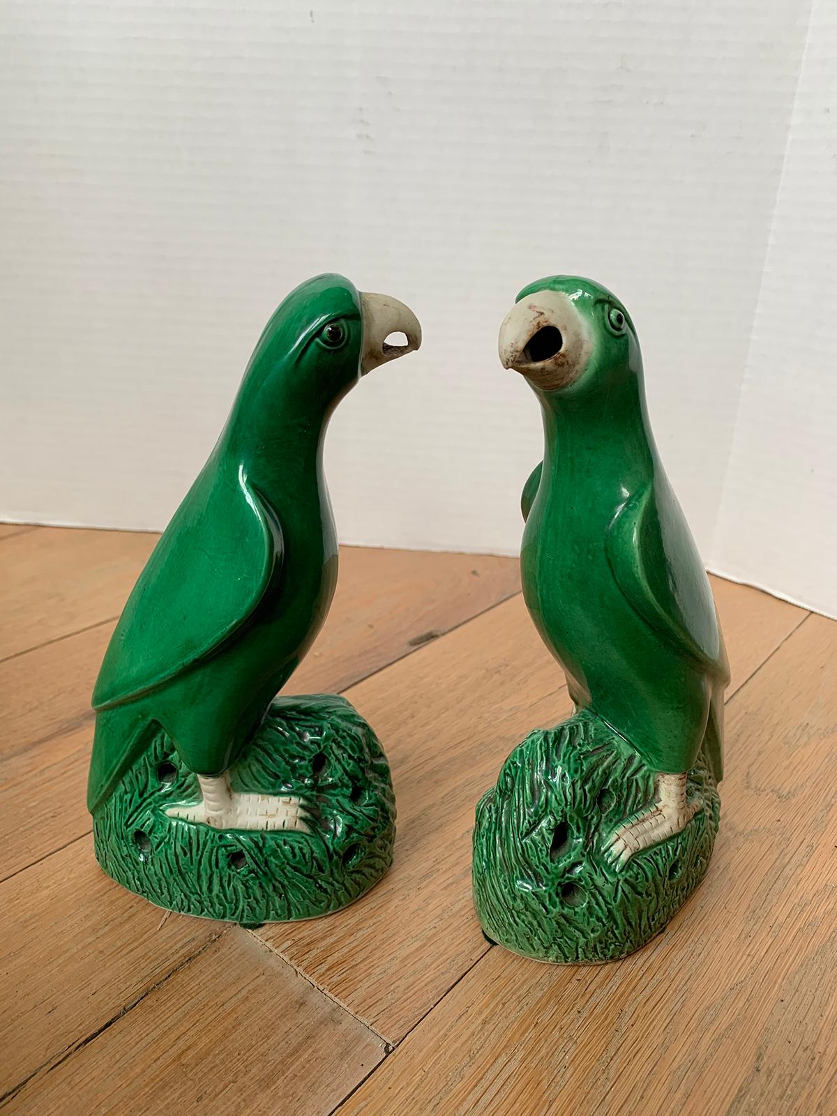 Pair of 19th century Chinese Export green glazed porcelain parrots, unmarked.