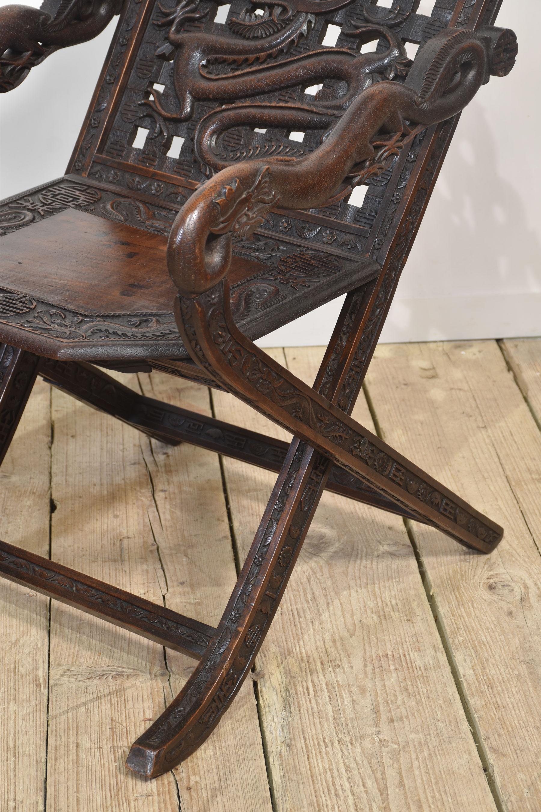 Wood Pair of 19th century Chinese folding armchairs For Sale