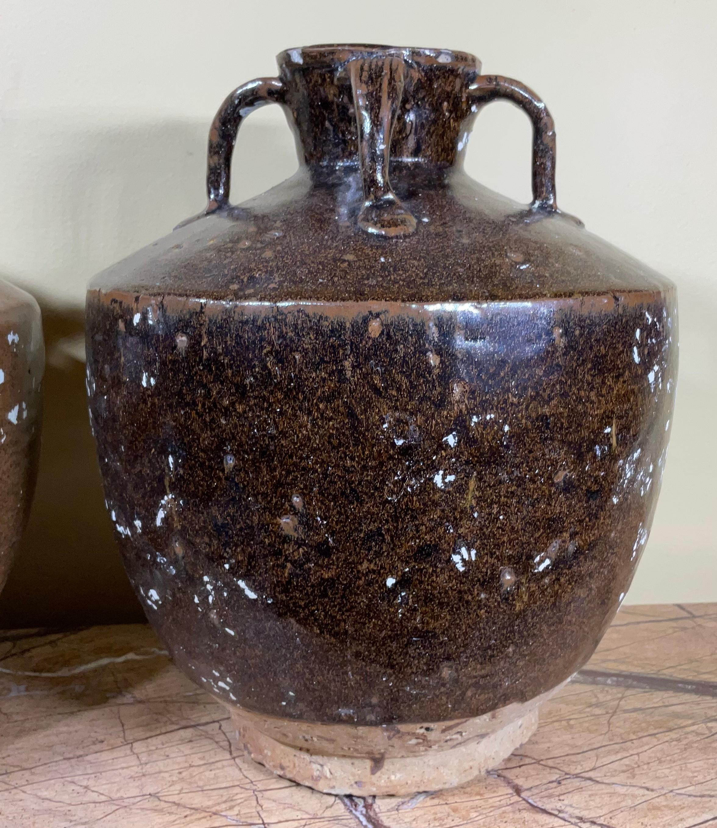 Pair of stoneware jars
In 19th century China jars like this would have held wines, foods, and other consumable items. Four small decorative Handel on each top, with earth-tone glaze colour to provide a unique texture rich with character.