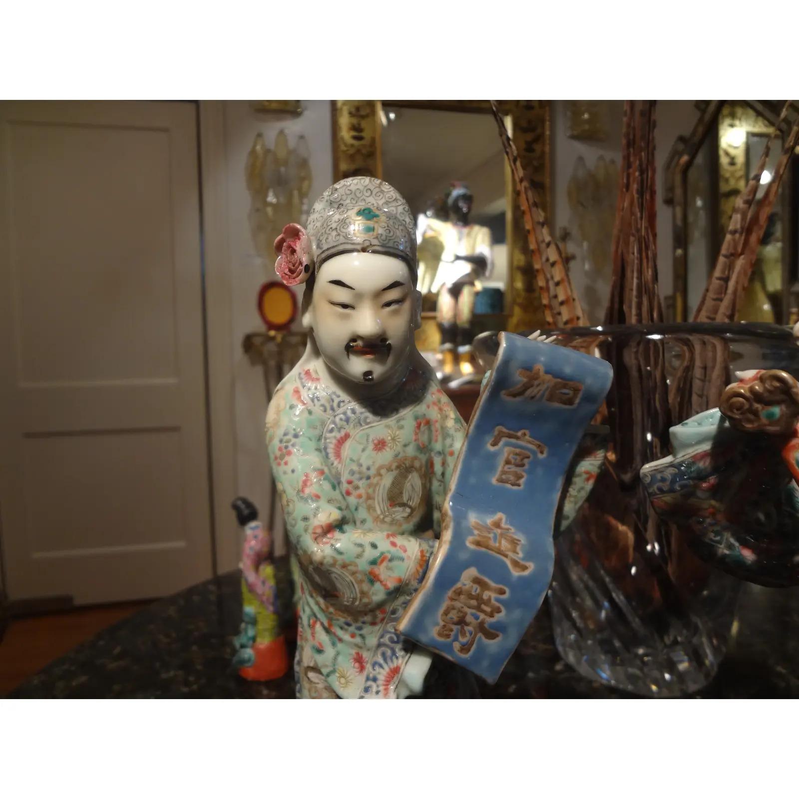 Pair of 19th century Chinese hand decorated porcelain scholar figures.
Stunning pair of well executed hand decorated Chinese porcelain figures or sculptures depicting scholars. These fabulous finely detailed figural Chinese statues are from the