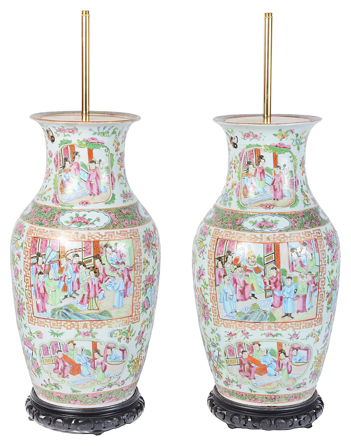 A good quality pair of 19th century Chinese canton, rose medallion vases or lamps. Each with green and pink floral and foliate boarders to the inset panels depicting classically dress Chinese people socializing in the gardens.