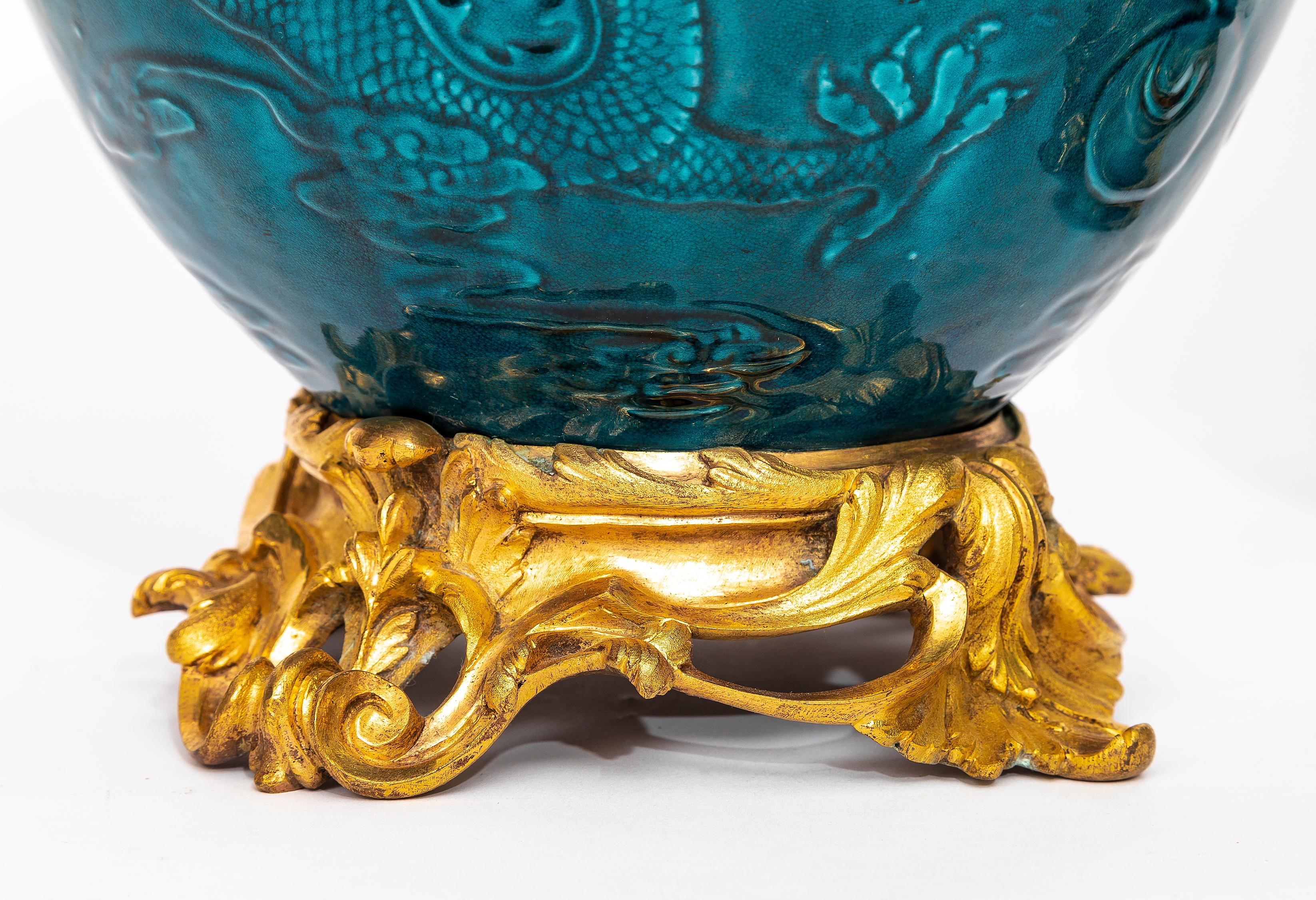 Pair of 19th Century Chinese Turquoise Porcelain Ormolu Mounted Covered Vases In Good Condition For Sale In New York, NY