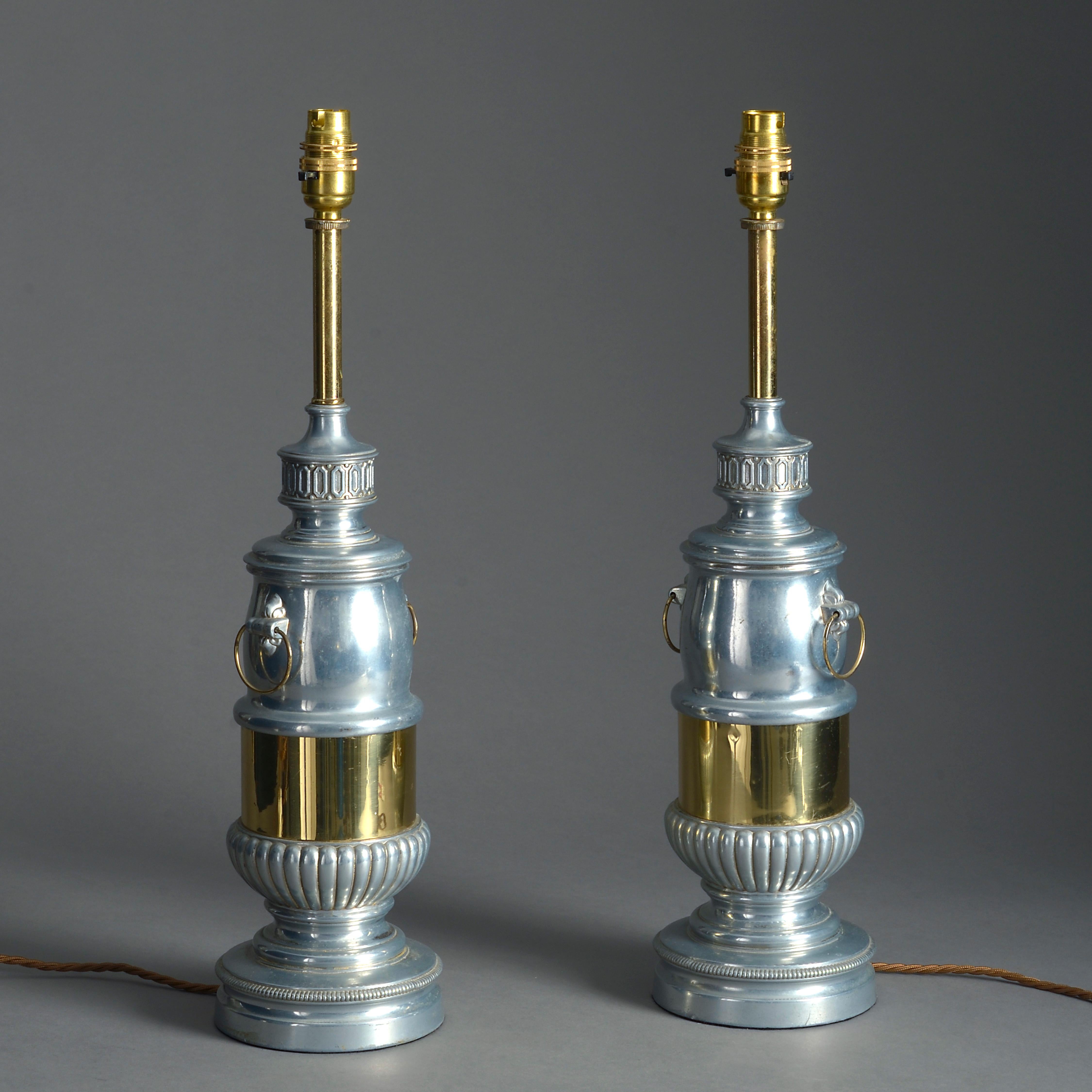 An unusual pair of late 19th century chrome and brass table lamps, in the Classical manner.

Dimensions include bayonet fittings.


   