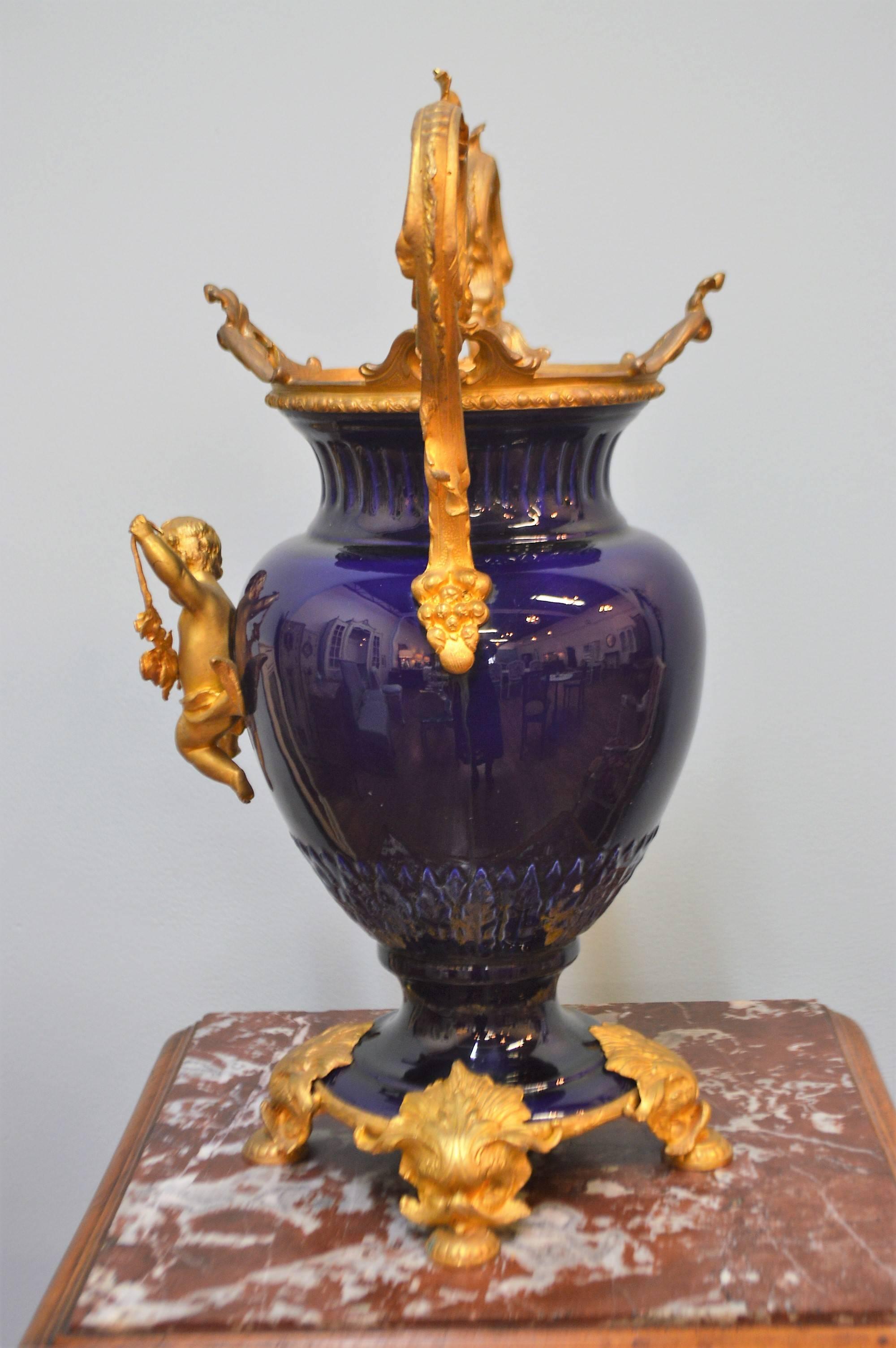 Louis XV Pair of 19th Century Cobalt Blue Porcelain Urns with Fine Gilded Bronze Elements