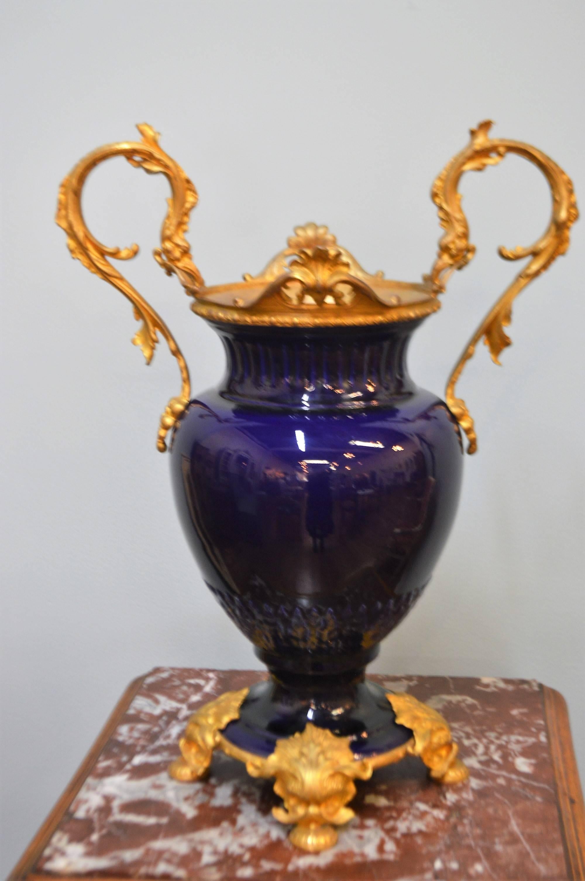 French Pair of 19th Century Cobalt Blue Porcelain Urns with Fine Gilded Bronze Elements