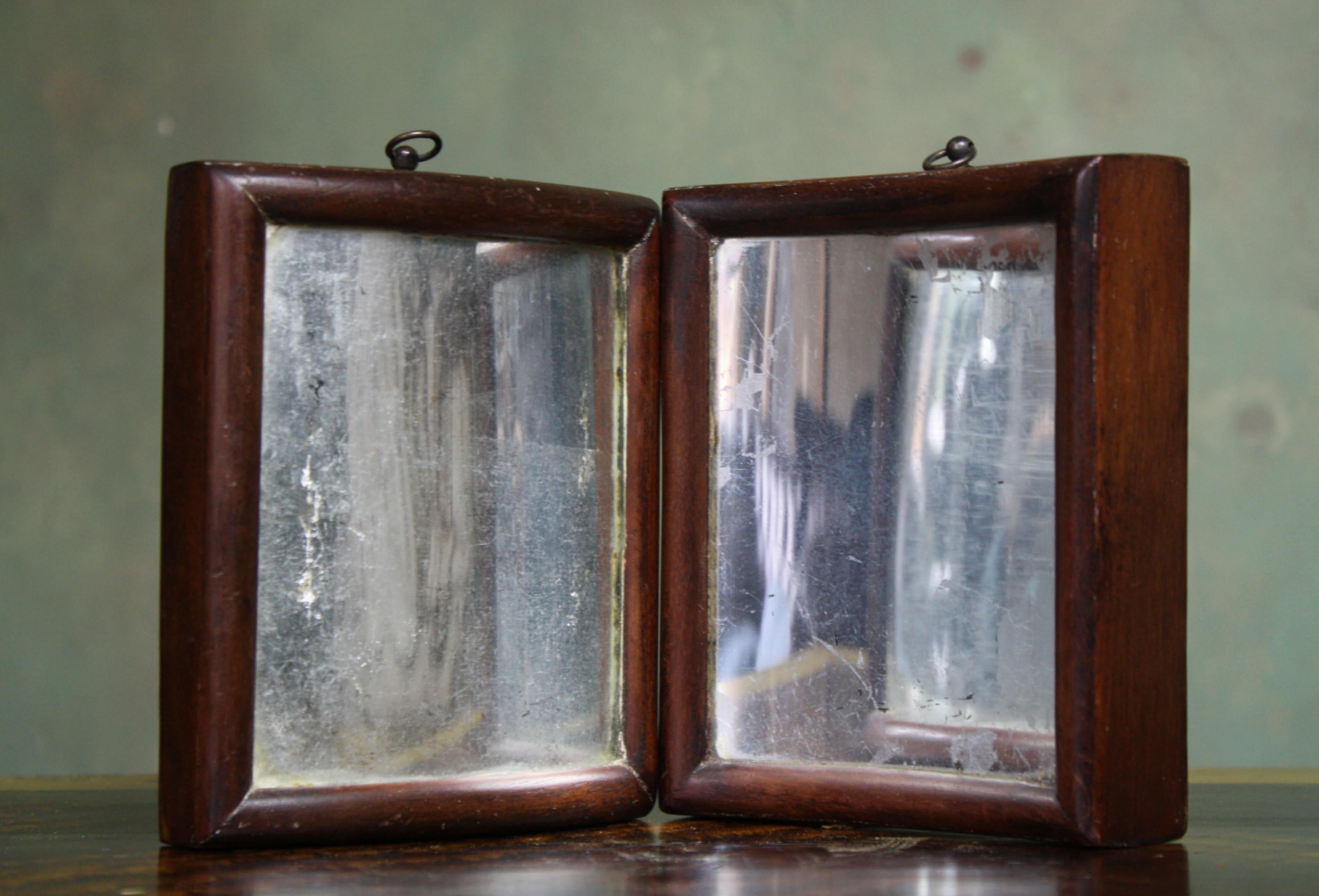 A very unusual pair of petite distortion mirrors, encased within their original oak frames with oxidised mirror plates, one mirror has a convex mirror plate the second a concave plate.

English in origin, early to mid 19th century in age 

These