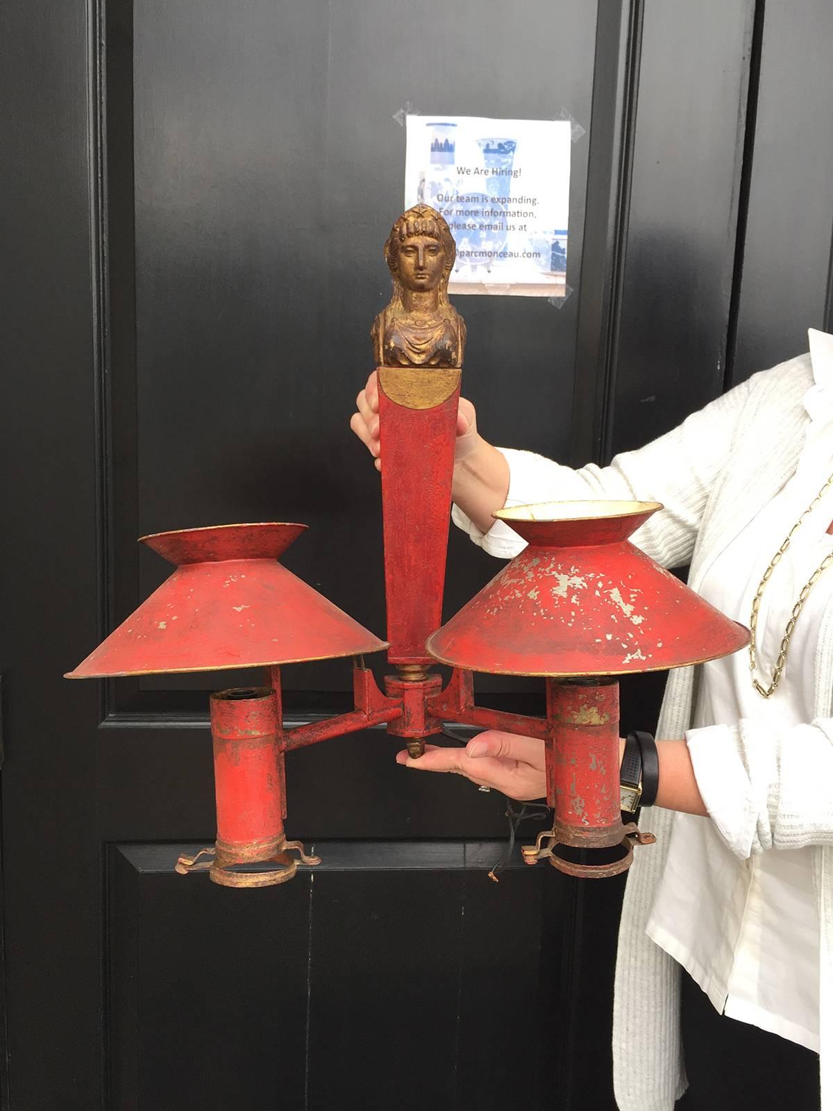 Pair of 19th century continental Empire red tole two-arm sconces.
