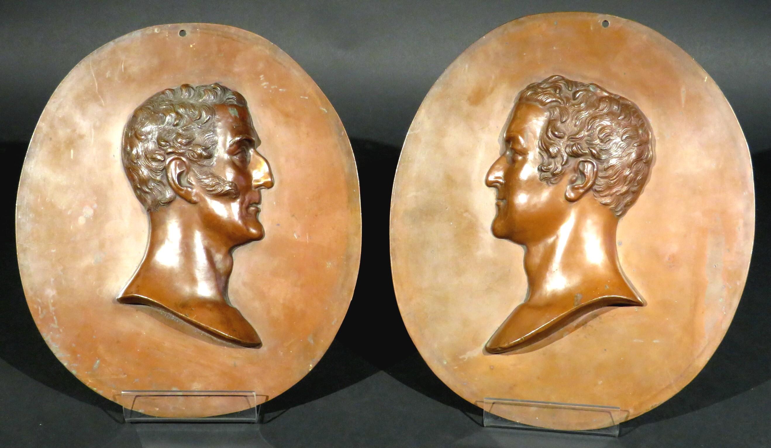 A very handsome and impressive pair of relief portrait busts in copper depicting portrait busts of Arthur Wellesley, 1st Duke of Wellington (1769-1852) on the left, and Napoleon Bonaparte (1769-1821) on the right. Dimensions of each are: