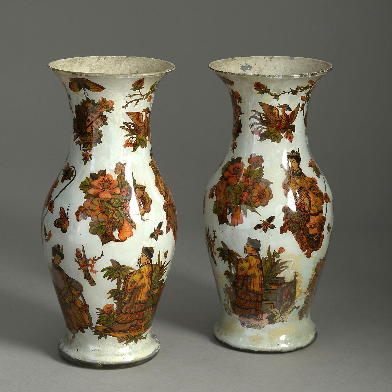 A pair of mid-19th century Decalcomania glass vases of baluster form, internally decorated with hand-painted polychrome chinoiseries upon a stone white ground.