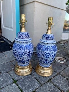 Pair of 19th Century Dutch Delft Blue and White Lamps, Gilded Bases
