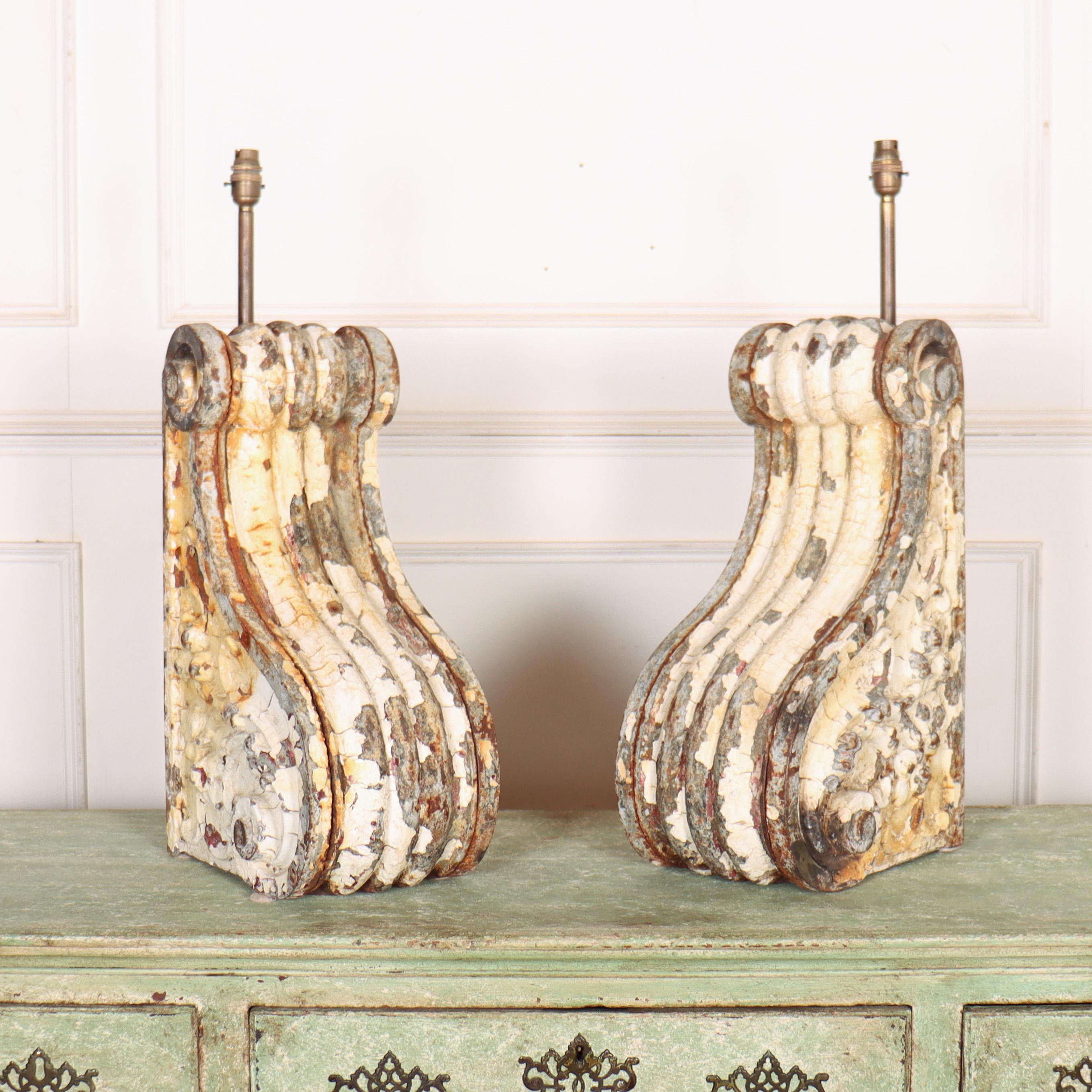 Pair of 19th Century Dutch cast iron corbles converted into table lamps with lovely original paint.

These have been PAT tested to UK standard