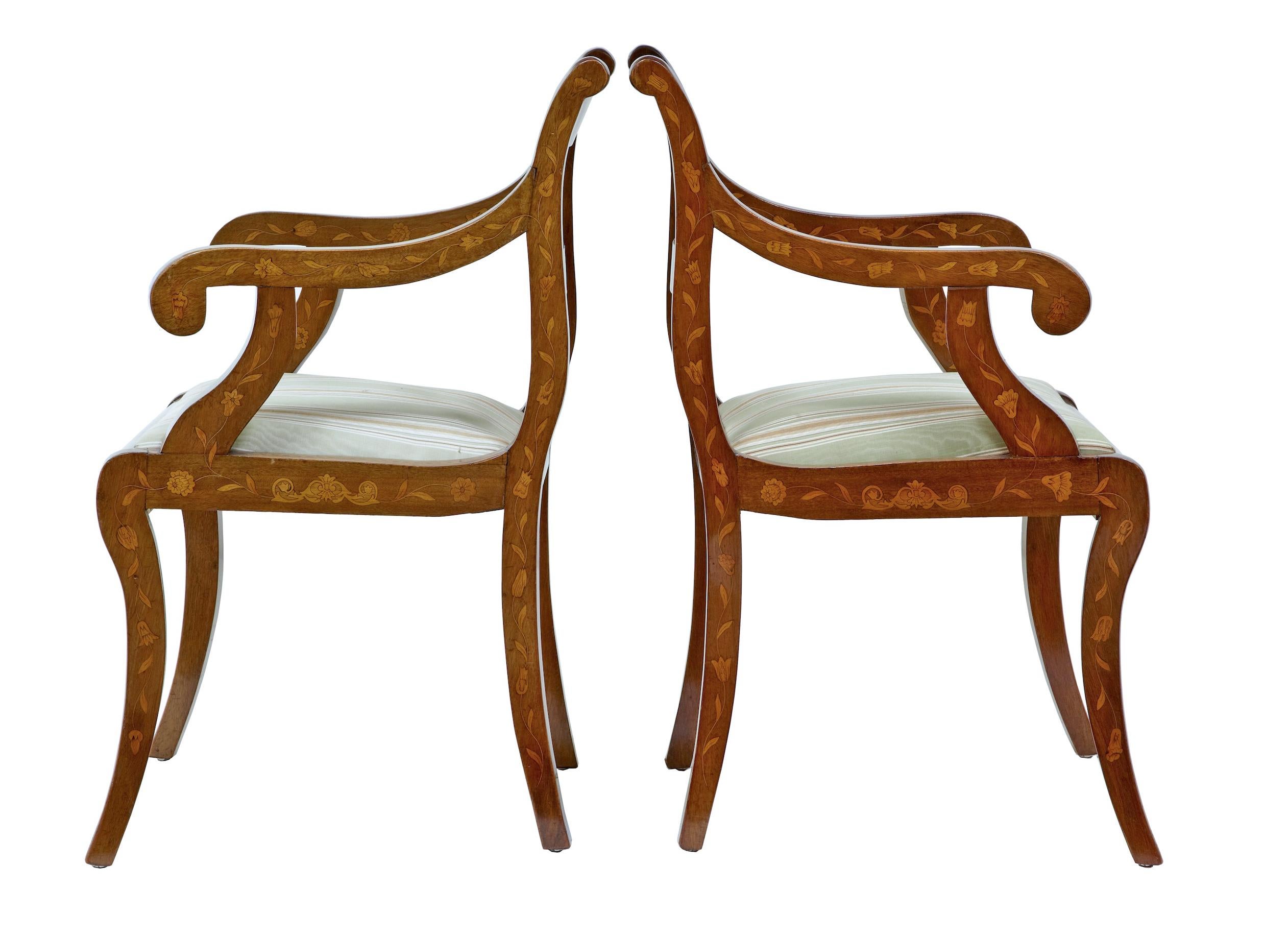 Pair of 19th century Dutch walnut marquetry armchairs, circa 1860.
Good quality pair of Dutch open armchairs. Shaped backs with scrolling arms, standing on sabre legs. Profusely inlaid on all surfaces with florals. With salt and pepper stringing to