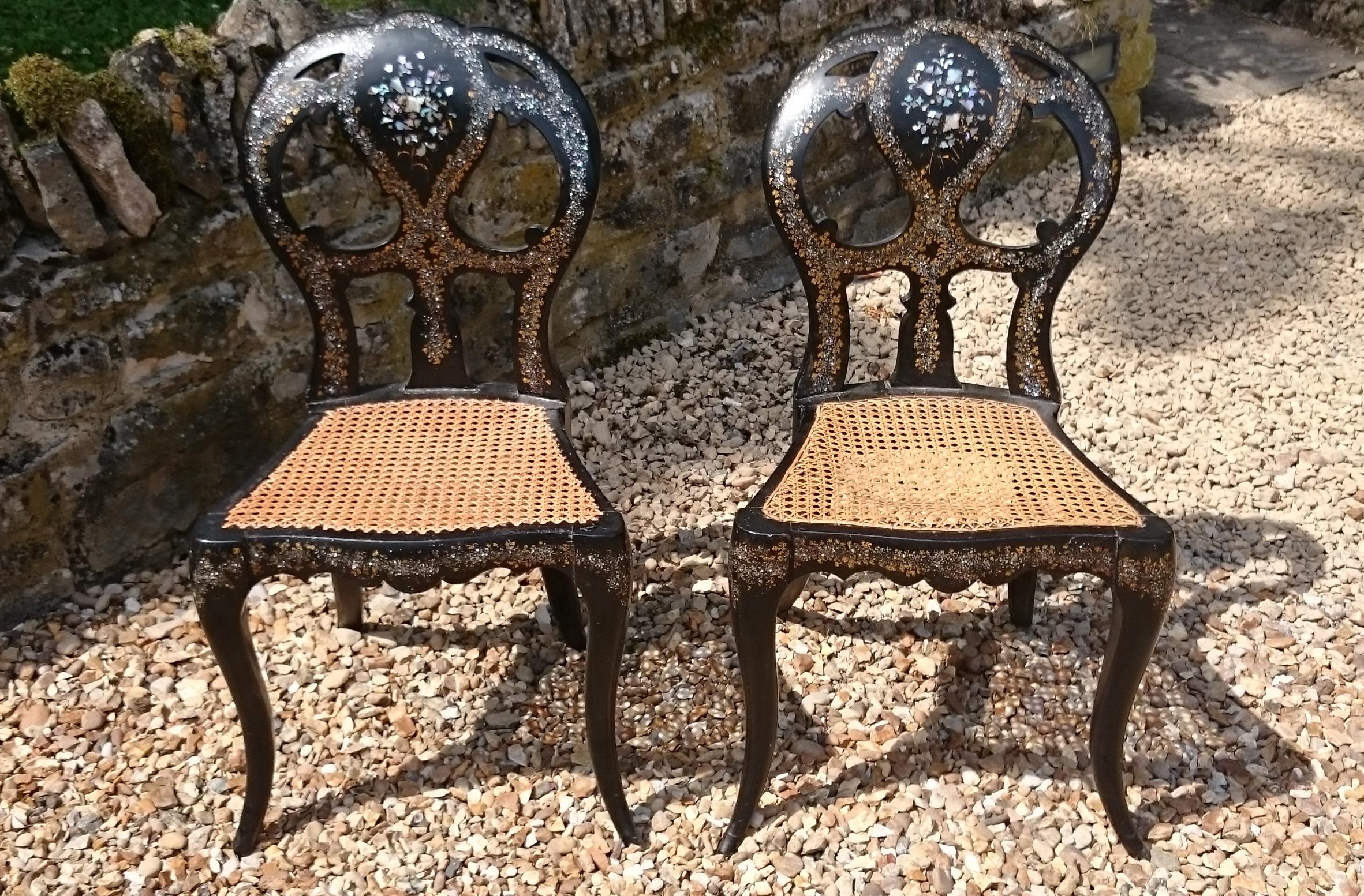 Very fine pair of 19th century ebonised and inlaid side chairs standing on cabriole legs. These chairs are a wonderful shape with unusually exaggerated form, very outswept back rest and legs which run together and outwards to an incredible