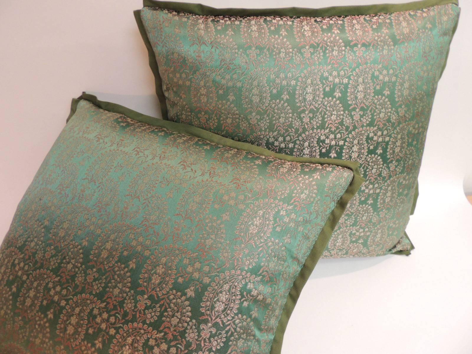 Pair of Green and Gold Embroidered Indian Saree Decorative Pillows
Square pillows with ATG custom flat silk trim and golden silk backings.
Decorative pillows handcrafted with an antique textile were hand-stitched and designed in the USA. 
Closure by