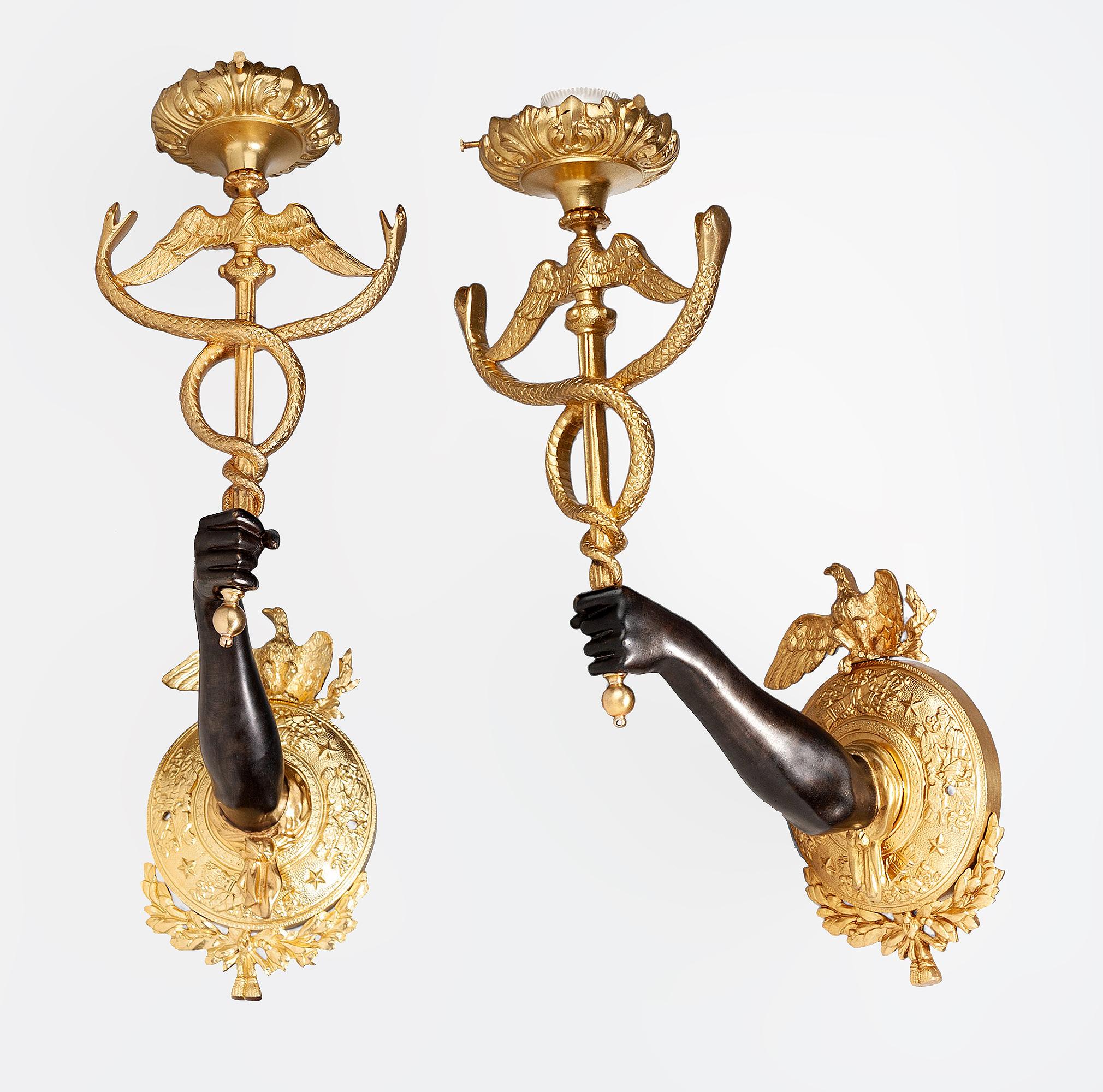 Pair of late 19th century Empire gilt bronze ormolu wall appliques of arms holding Caduceus staffs, France

By: unknown
Material: bronze, copper, metal, cord, ormolu
Technique: cast, molded, gitl, patinated, polished, metalwork
Dimensions: 9 in x