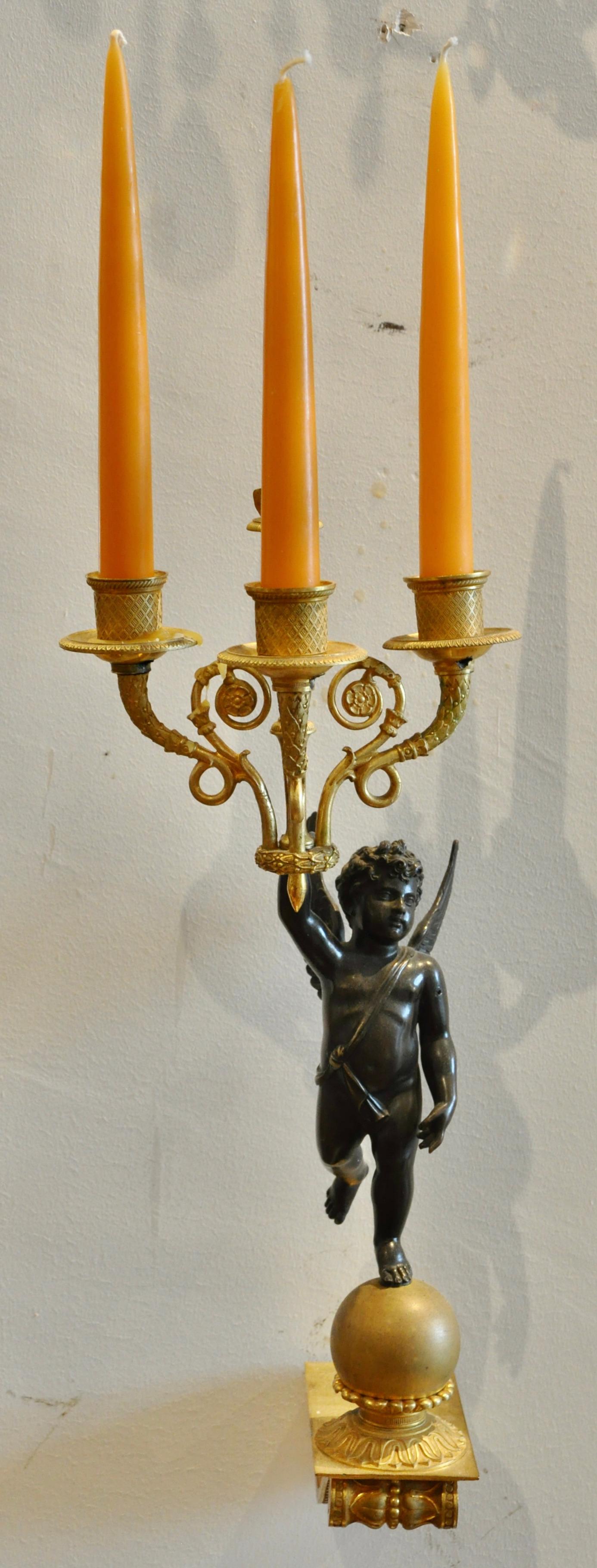 Patinated Pair of 19th Century Empire Ormolu and Bronze Cupid Sconces