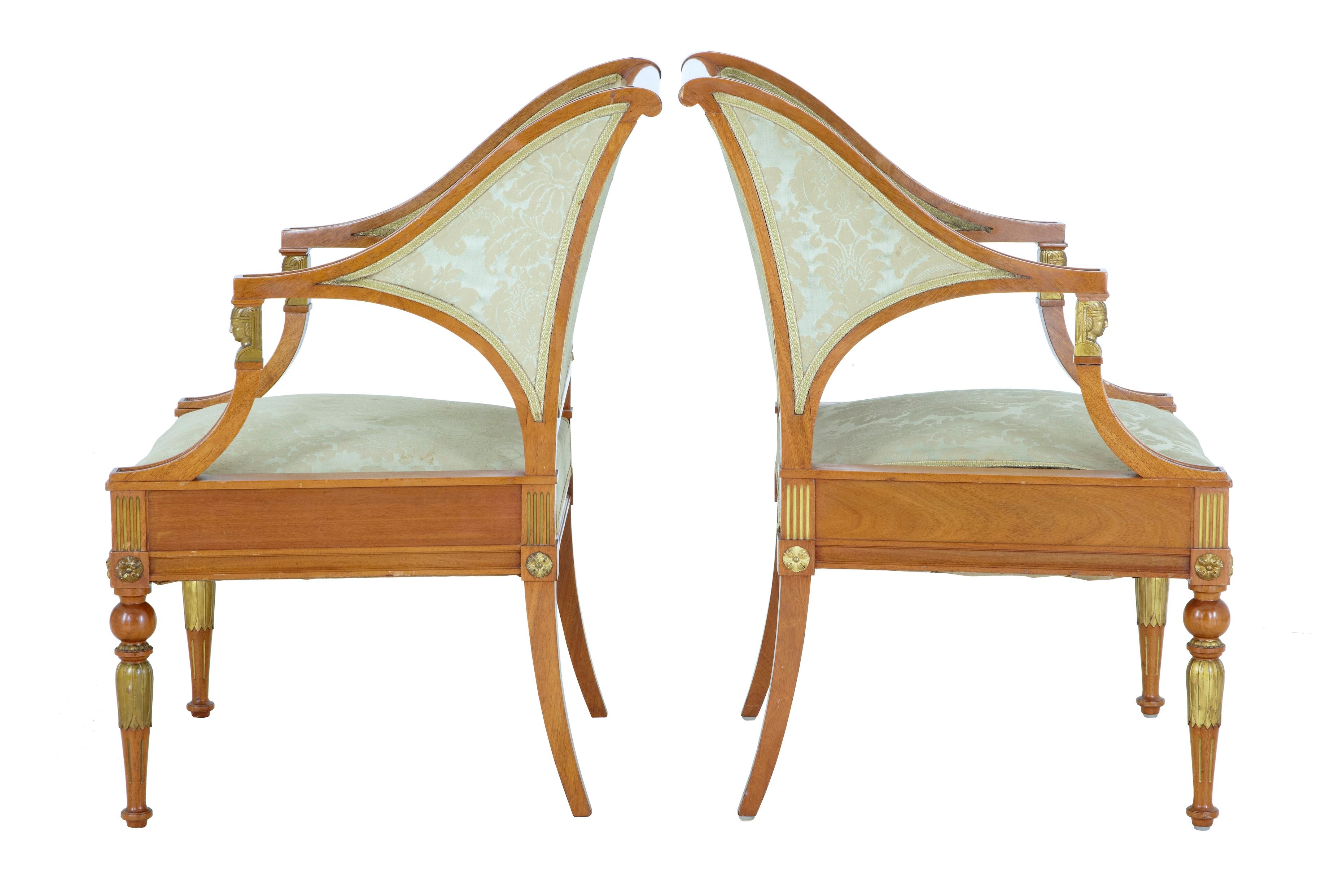 Well designed pair of 19th century armchairs, circa 1890.
Very much in the Empire taste, with shaped arms that lead down to ormolu Egyptian mounts.
Applied roundels to the top of the legs and carved gilt leaf detail.

Fabric with some staining