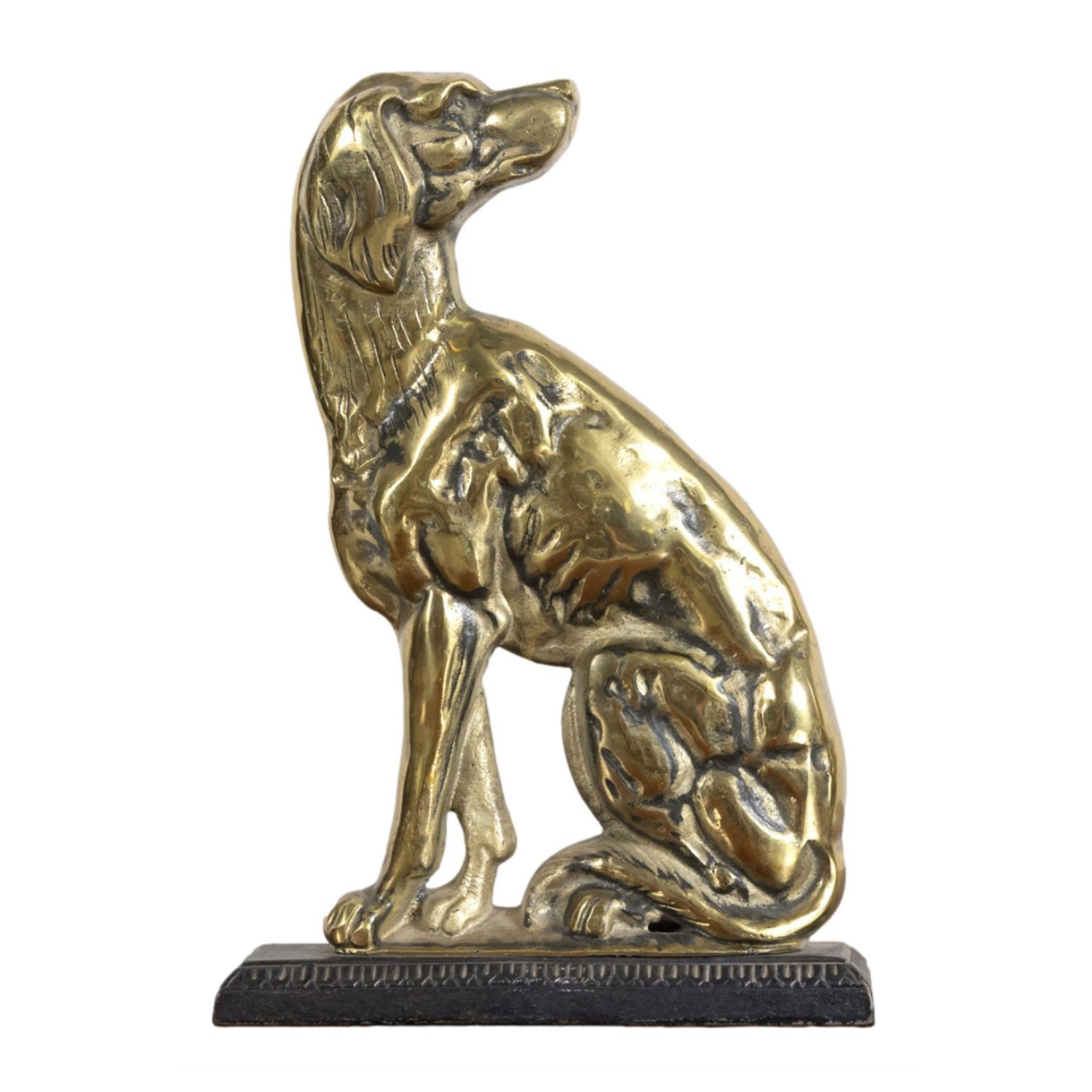 A superb pair of 19th century English antique brass doorstops, cast as hunting dogs or hounds and set upon iron plinth bases, circa 1870s. These fine decorative dog sculptures are a nice size and very well made with wonderful details. Would also be