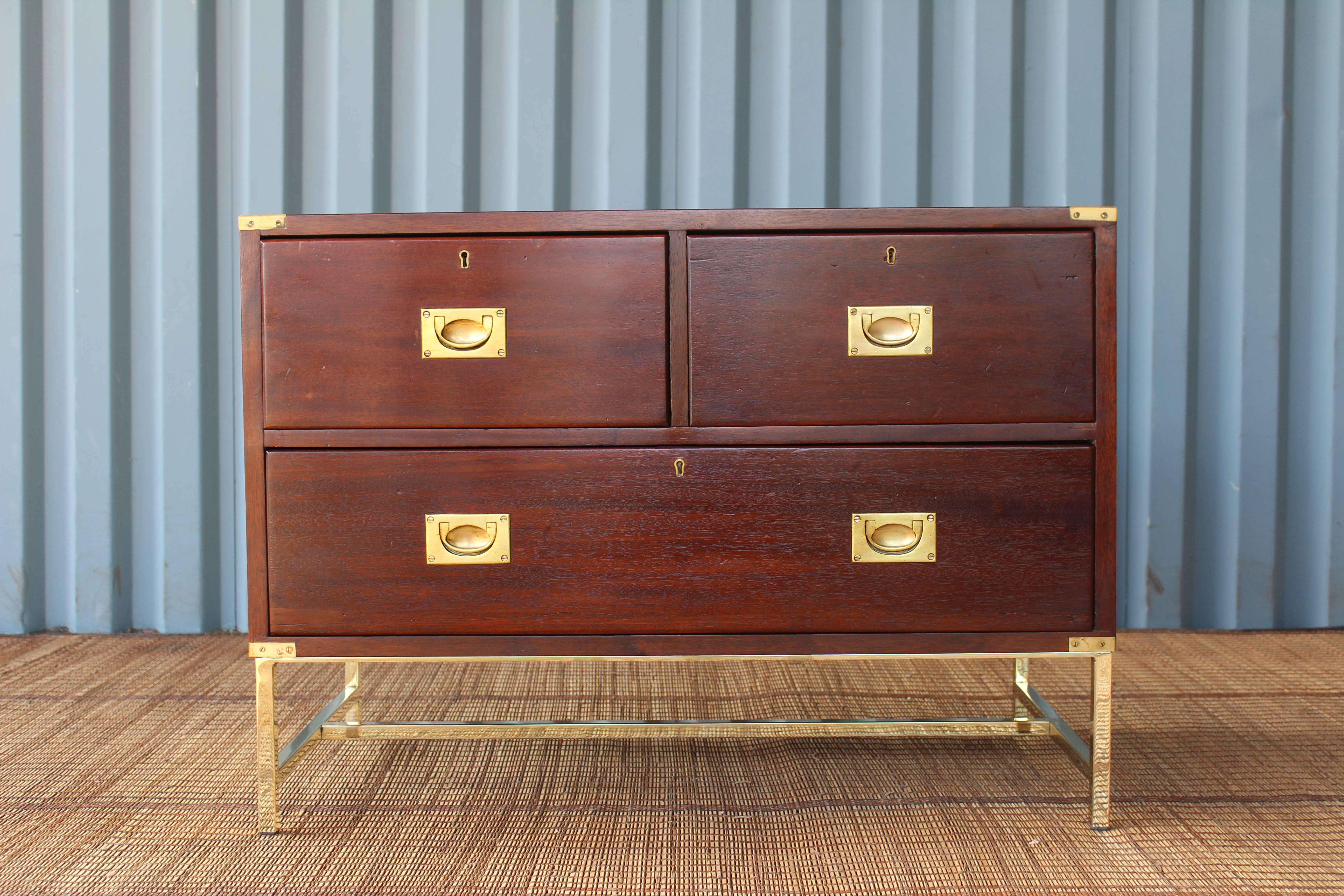 Pair of 19th century English Campaign chests in solid mahogany. Suitable for bedside tables. The pair have been professionally refinished and feature custom-made brass plated bases.