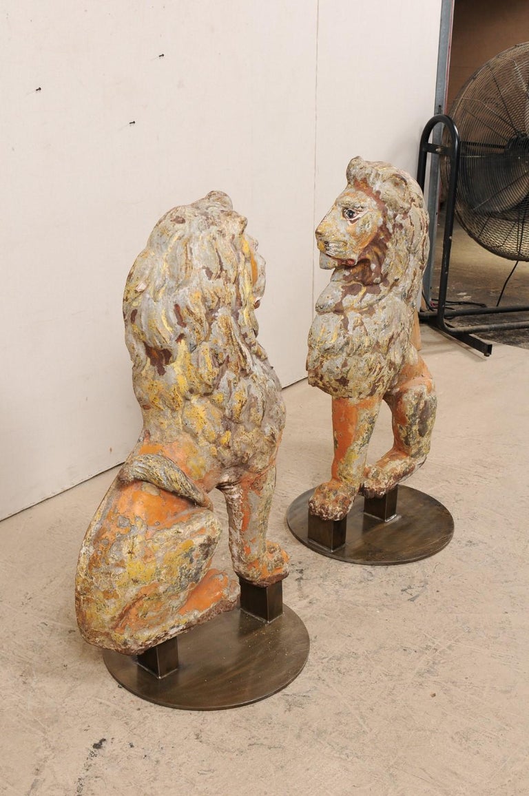 Pair of 19th Century English Cast Iron Sitting Lion Statues For Sale at