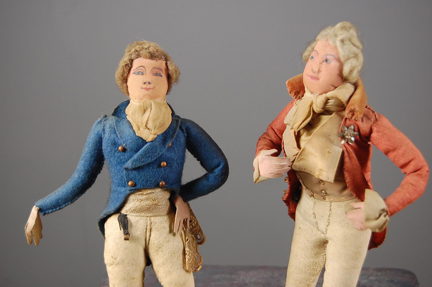 Wonderful pair of mid-19th century Georgian Dandy figures. Exquisitely made in mixed media of silk, leather, fabric. incredible attention to detail with handkerchiefs, buttons, and buttonholes, England, circa 1850. Priced for the pair.