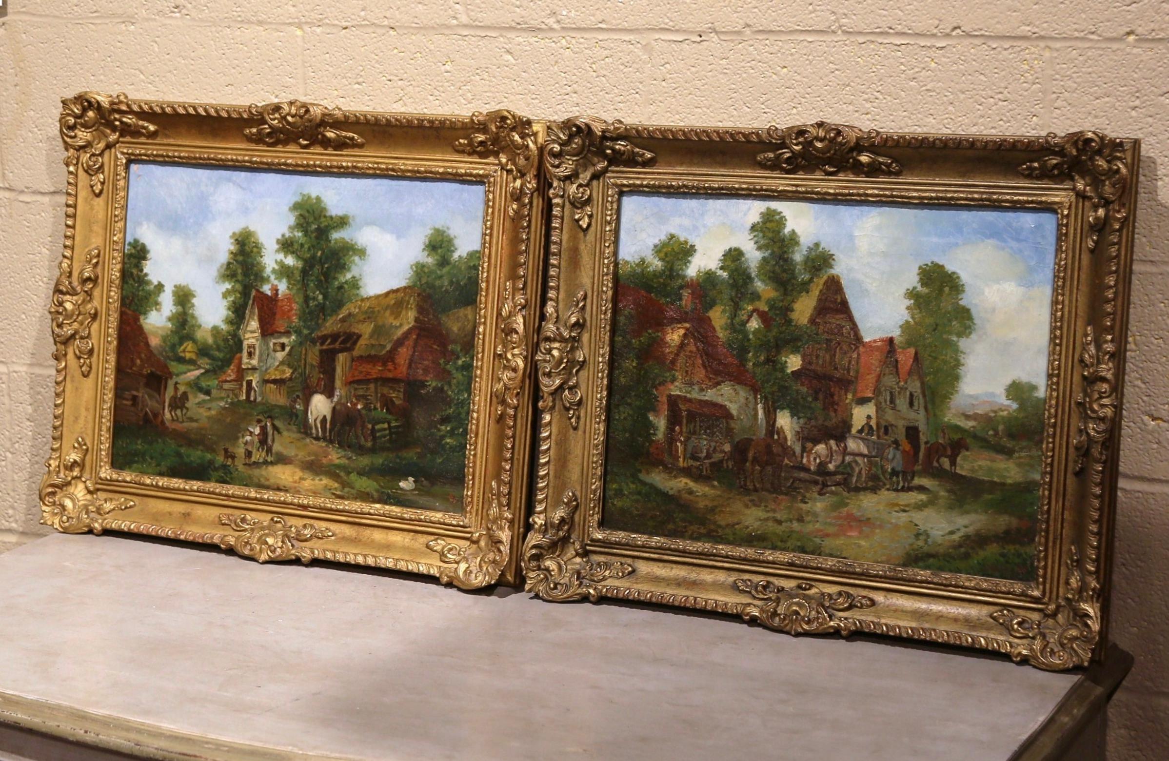 Decorate a living room or office with this elegant pair of antique paintings. Created in England circa 1870, both colorful art work are set in the original carved gilt wood frame. Each composition depicts a small country hamlet with farmhouse,
