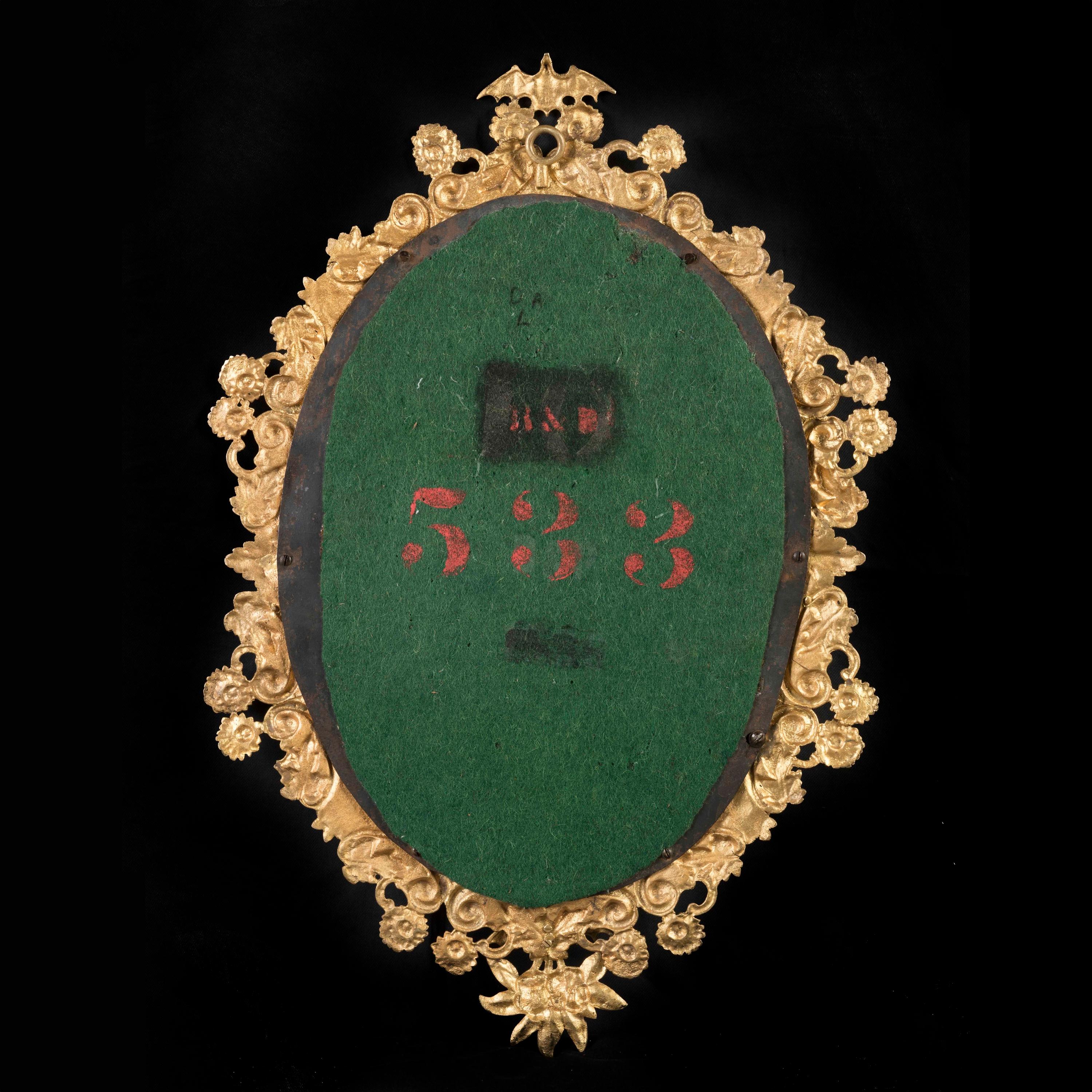 Pareja de espejos ovalados ingleses del siglo XIX con marco de ormolu Ormolú en venta