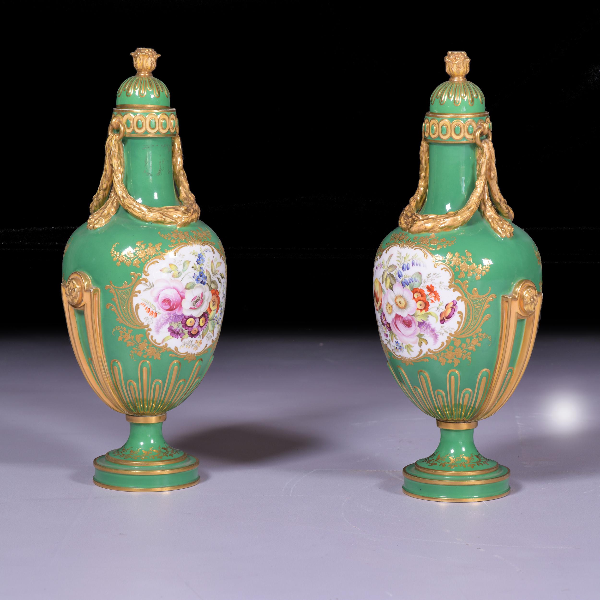 A very fine and attractive pair of Coalport vases and covers, painted to one side with a panel of two children and to the other side with a panel of colourful flowers, the crisply modelled rope handles and finials picked out in gold, the elaborate