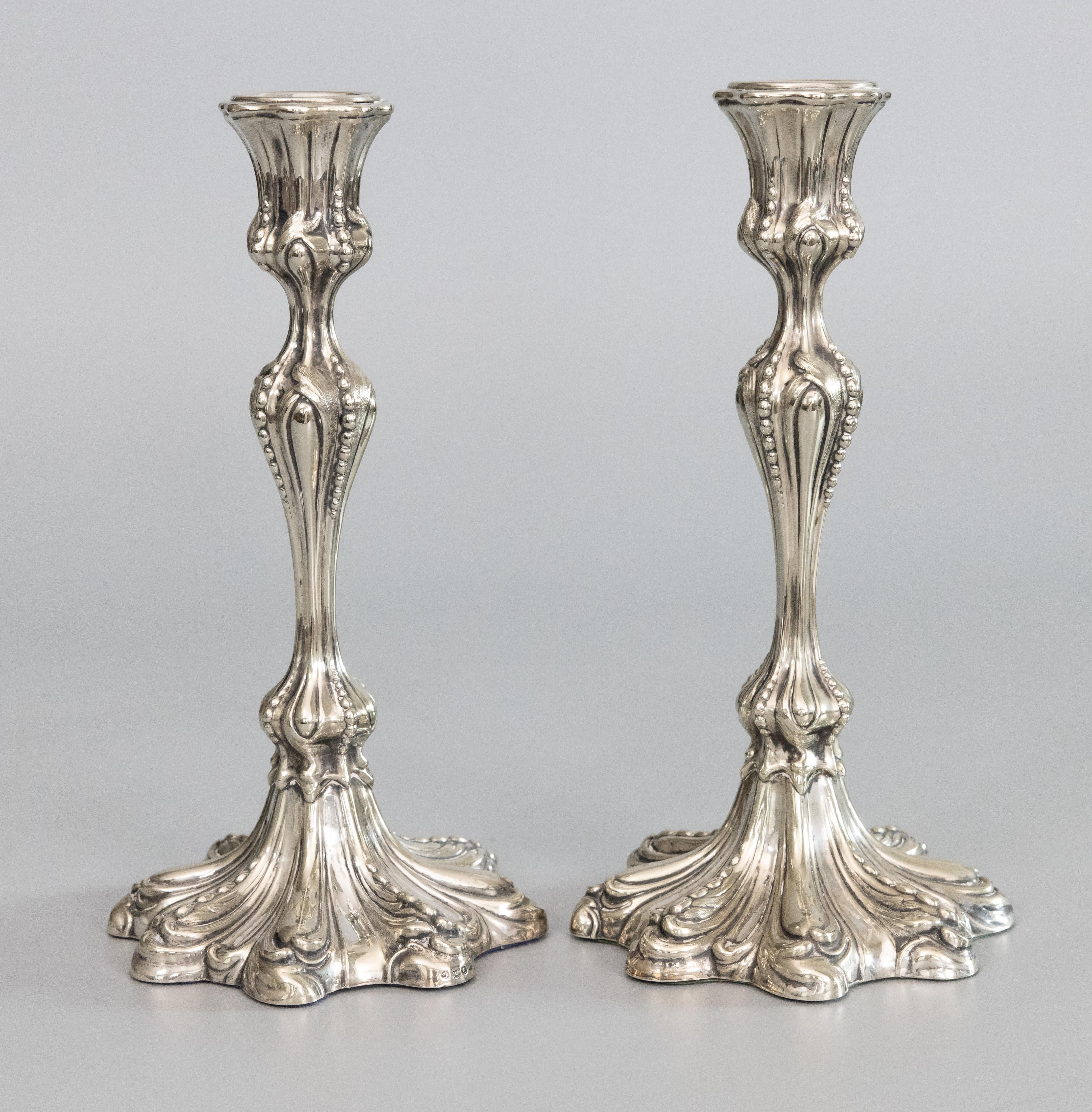 A superb pair of antique 19th-Century English silverplate candlesticks by JFF & Co, circa 1860-1870. Hallmarks on base. These gorgeous candle holders are a nice tall size and heavy with a lovely shape and an ornate Rococo style design.

