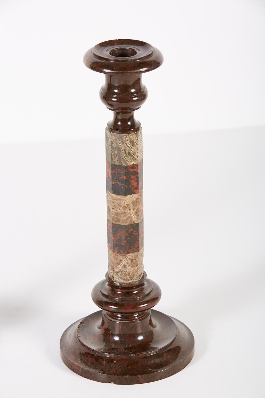 Pair of 19th century English candlesticks in red and green serpentine, a stone that is unique to England's Cornish region. Objects made from this stone were popularized by Queen Victoria and Prince Albert when they placed an order for Cornish