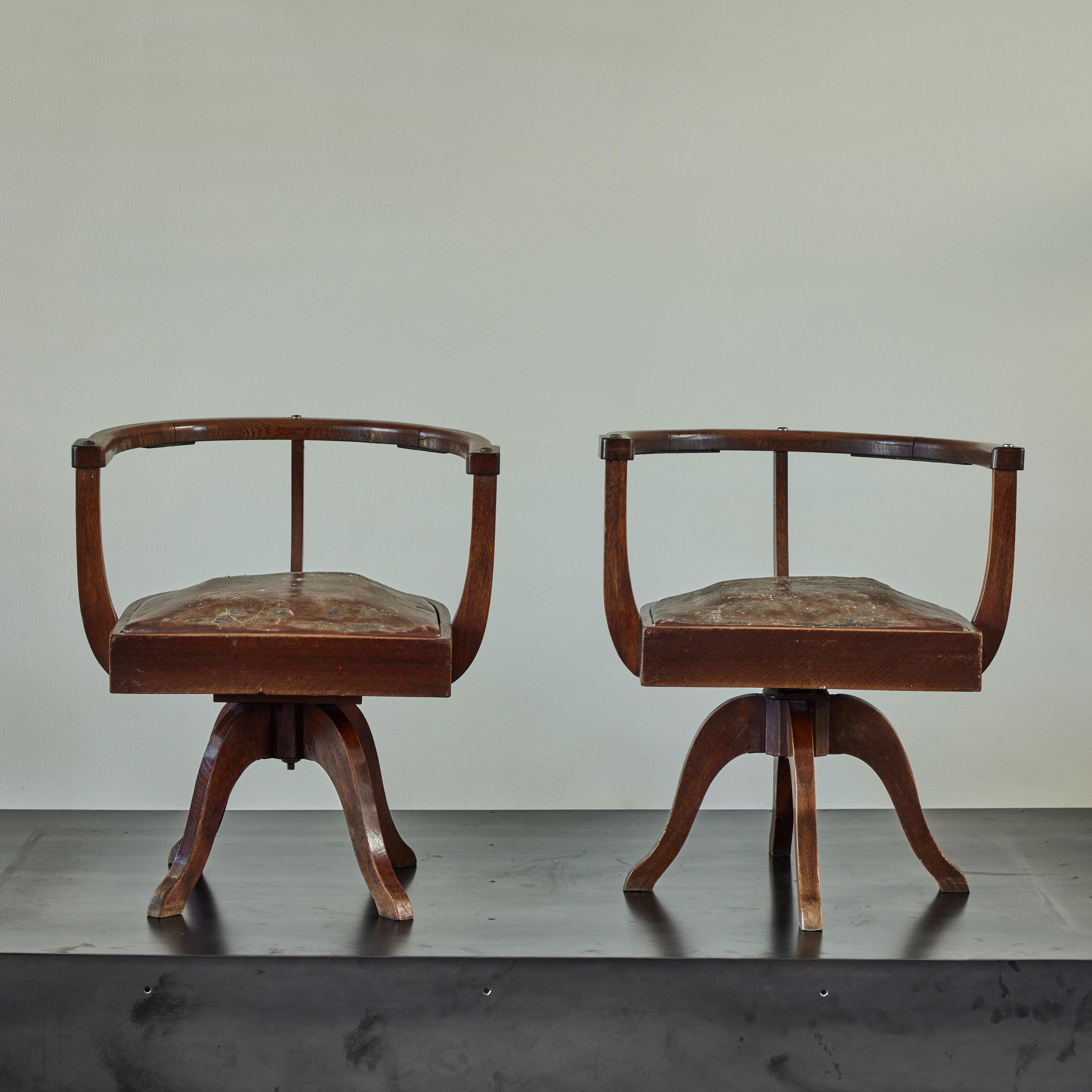 Sculptural study chairs from late 19th century England. With softly worn auburn leather drop-in seats and minimalist oak wood accents, these chairs have a refined, scholastic feel. 

England, circa 1880

Dimensions: 25W x 22D x 27.5H (seat