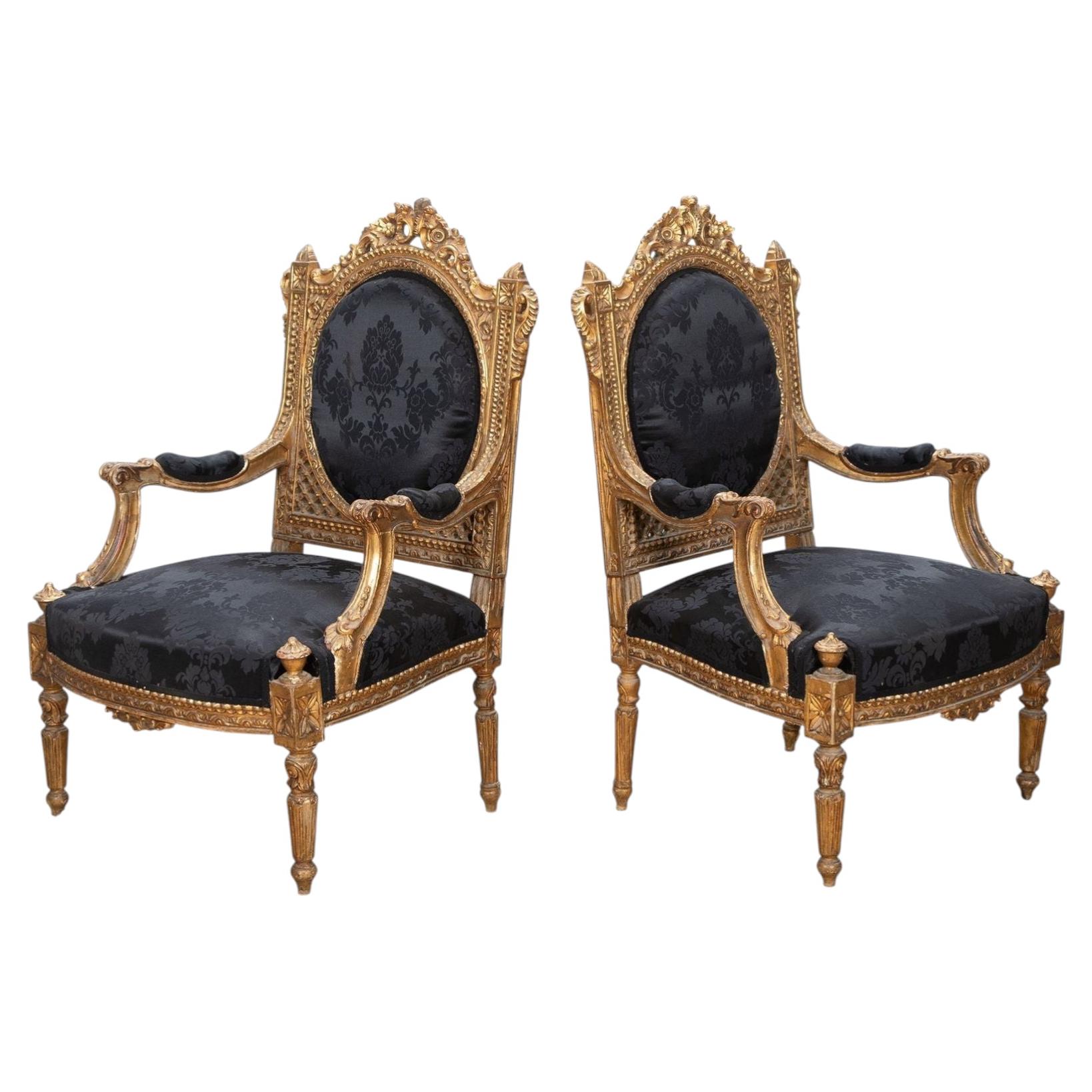 Paire de fauteuils anglais dorés et tapissés du 19e siècle