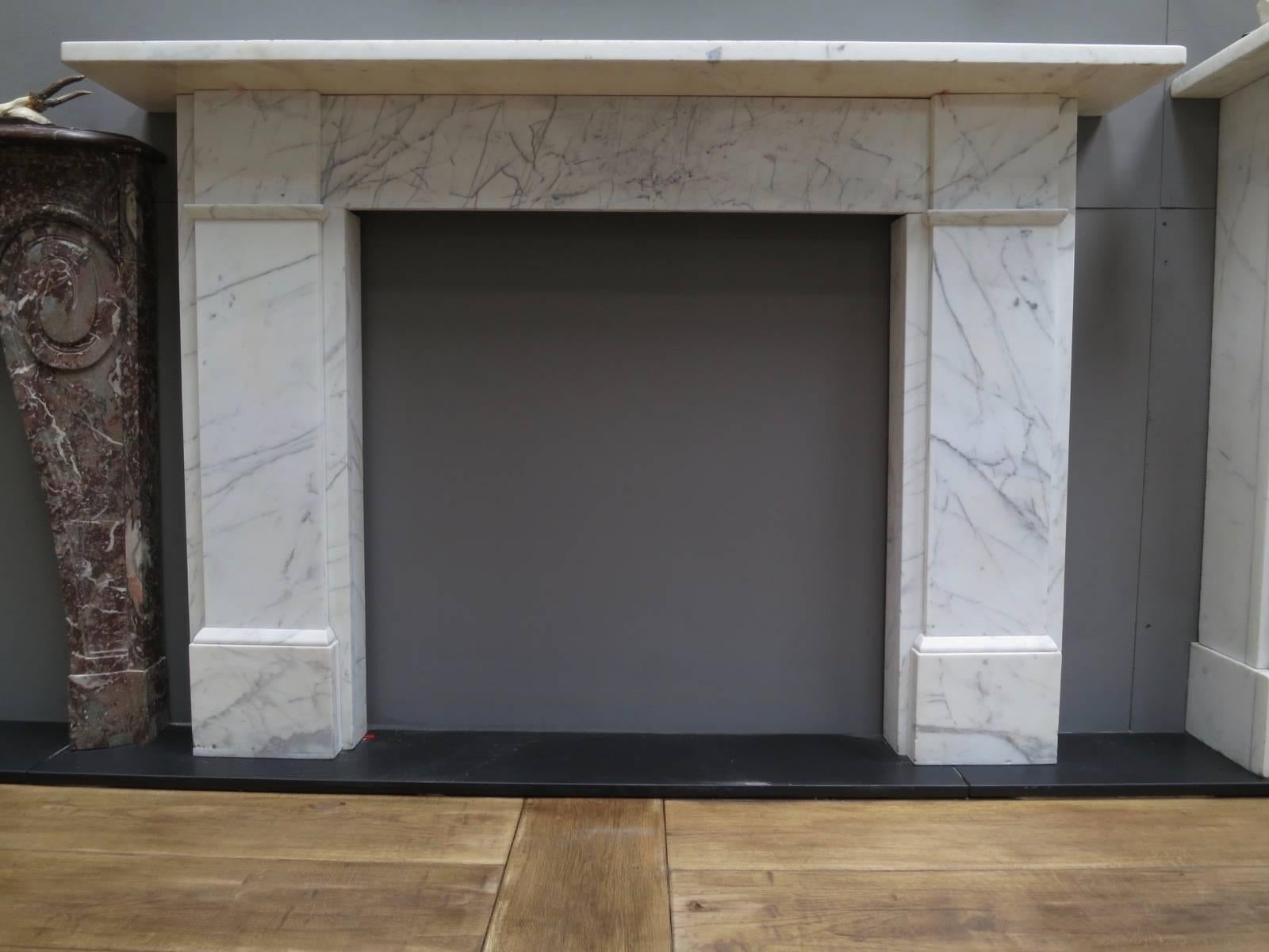 A large pair of fireplaces from the mid-19th century in veined white marble, simply designed and typical of that period, however in very high quality marble. One as usual slightly smaller than the other.

Opening sizes 
94cm H x 95.5cm W
