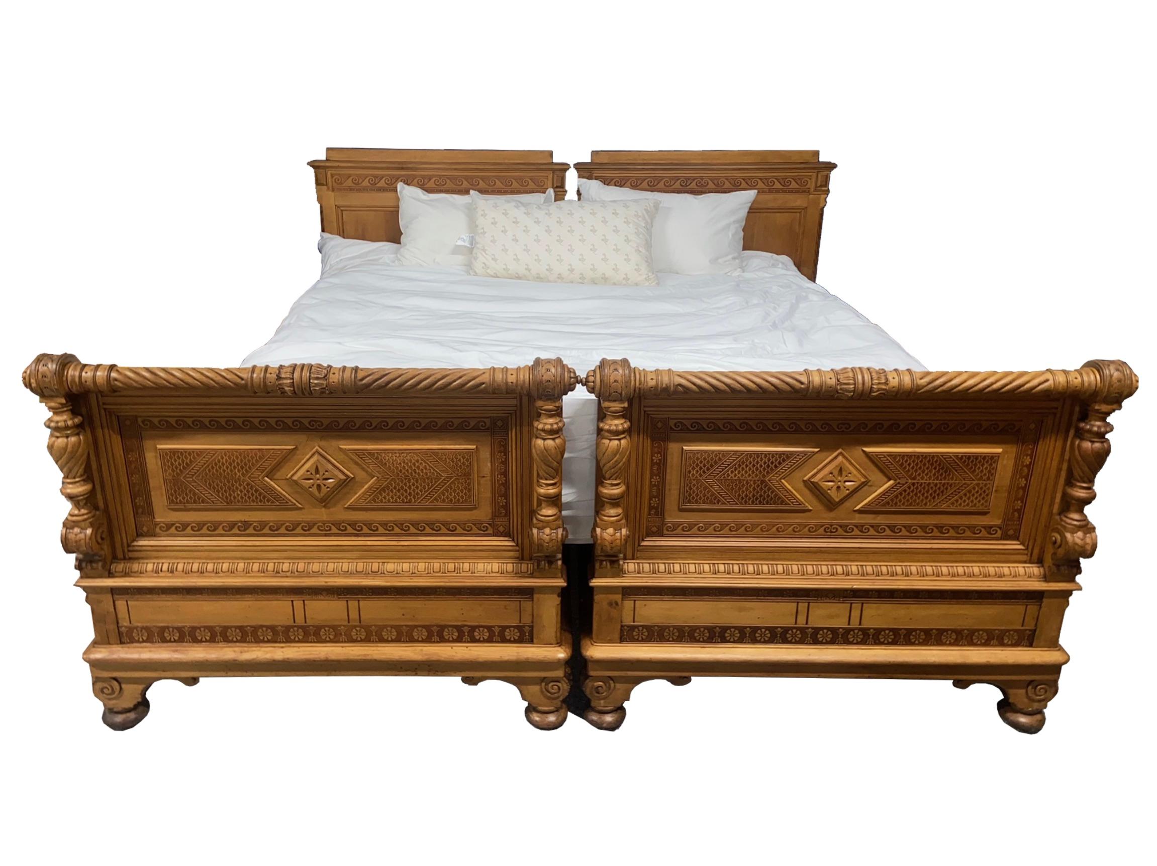 47.5″H x 88″D x 91.5″W

A striking and elaborately carded pair of vintage Austrian bed may just suit a snowy mountain retreat. Now reconfigured for a custom king mattress, these beds can pair with matching side tables and an amour which all belonged
