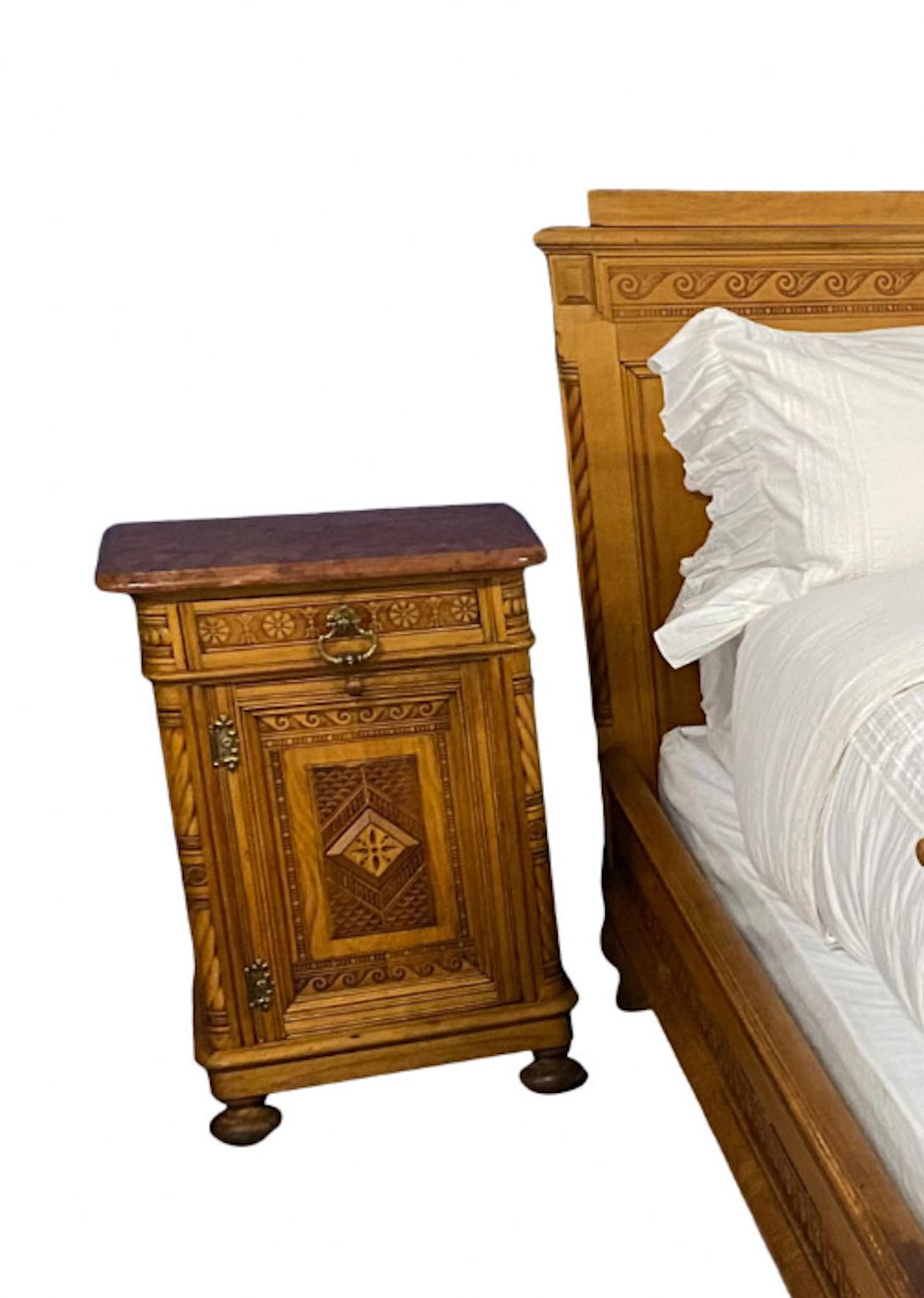A striking and elaborately carded pair of vintage Austrian bed may just suit a snowy mountain retreat. Now reconfigured for a custom king mattress, these beds can pair with matching side tables and an amour which all belonged to a complete suite of