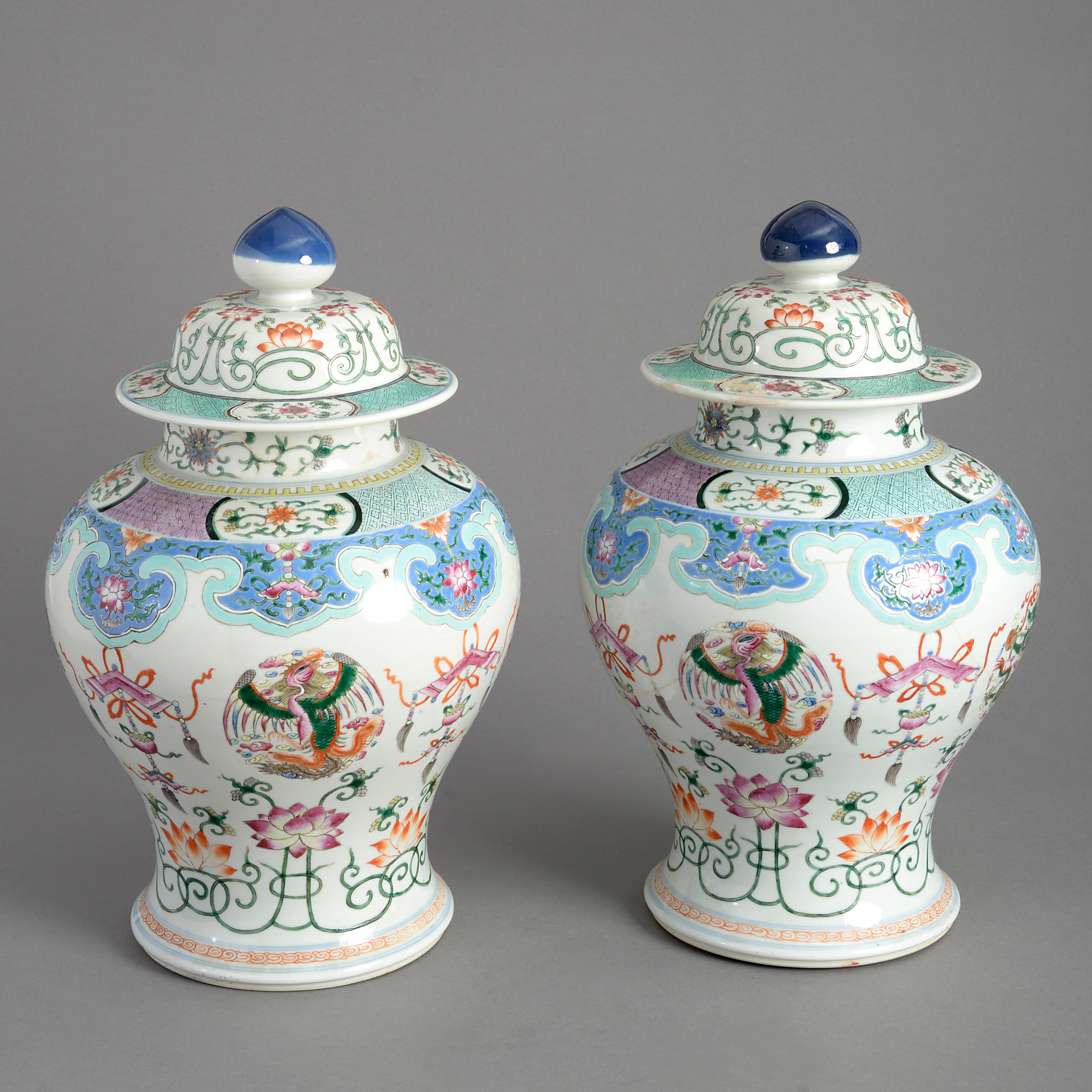 A fine 19th century pair of porcelain baluster form vases with covers, decorated throughout in famille rose glazes upon a white ground.

Both vases restored

Late Qing Dynasty (1644-1912).

   