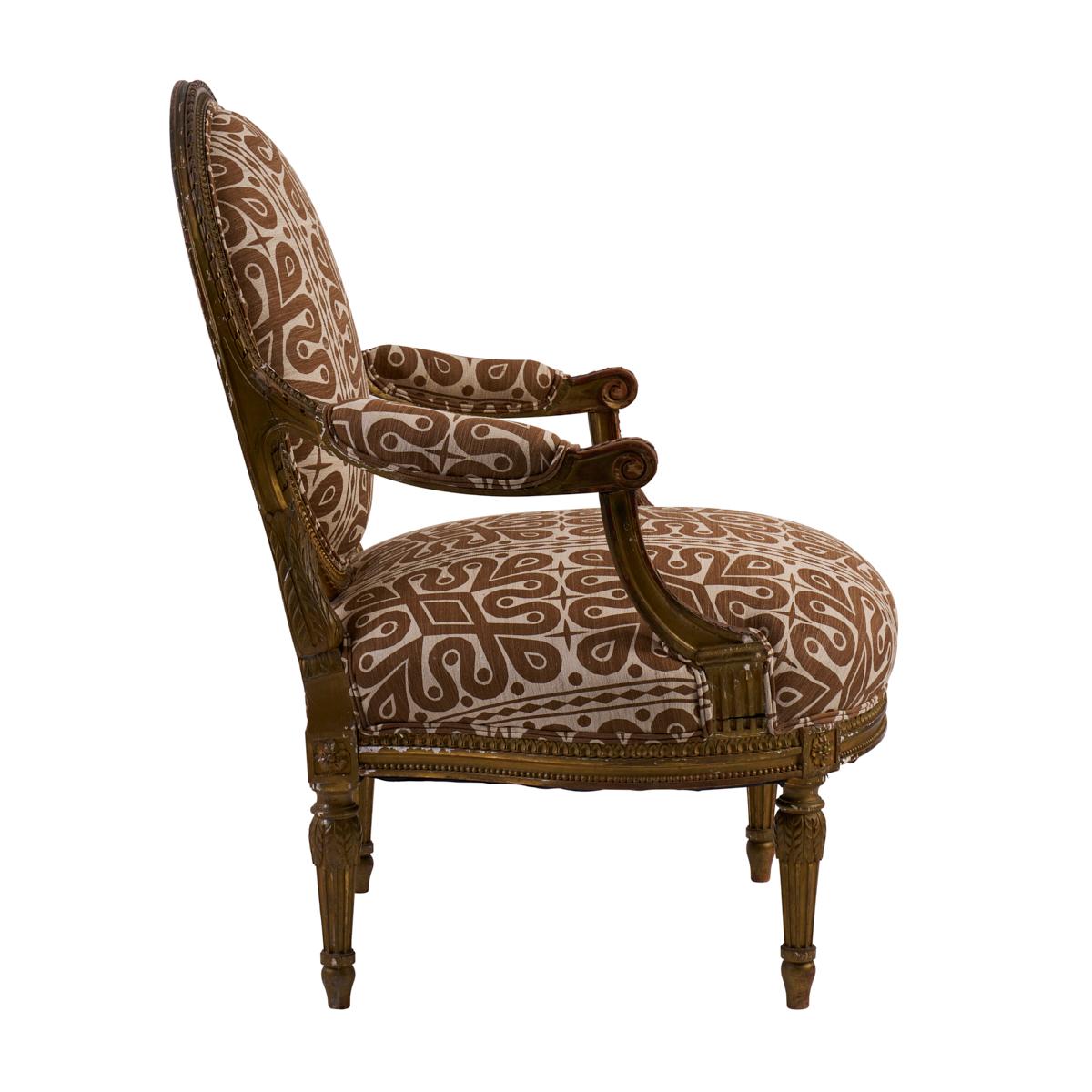 Discovered in the South of France, these dressy 19th-century fauteuils have the oval backs, scrolled handrests and straight legs associated with Louis XVI pieces. Newly upholstered in Schumacher's Borneo Silk fabric by Celerie Kemble for Schumacher,