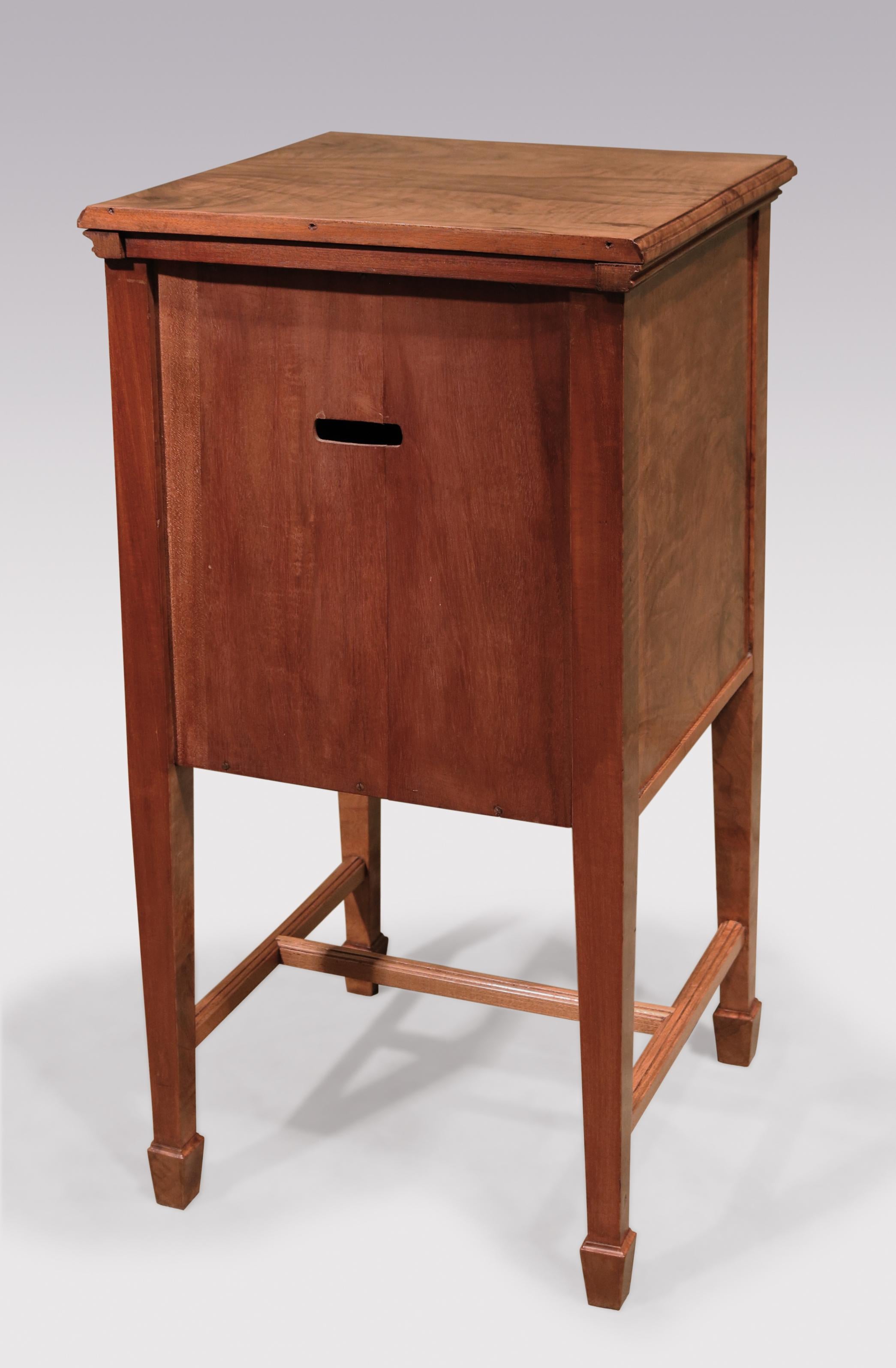 A pair of late 19th century continental olivewood bedside cabinets, tulipwood and ebony inlaid throughout, having frieze drawers above cupboard doors supported on square tapering legs with stretches and spade toes.