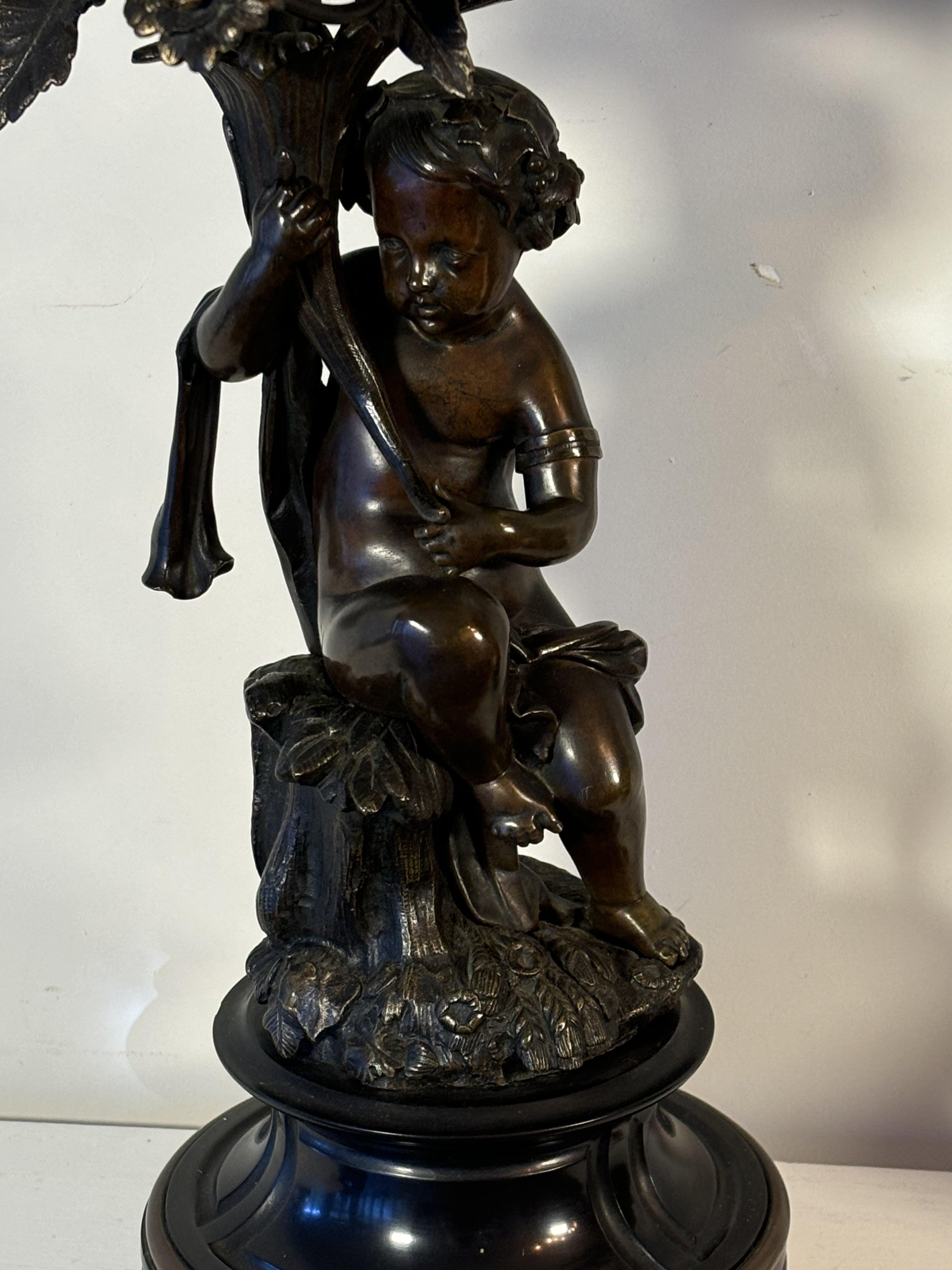 Patinated Pair of 19th century Five-Light Candelabras, in bronze, decorated With Putti