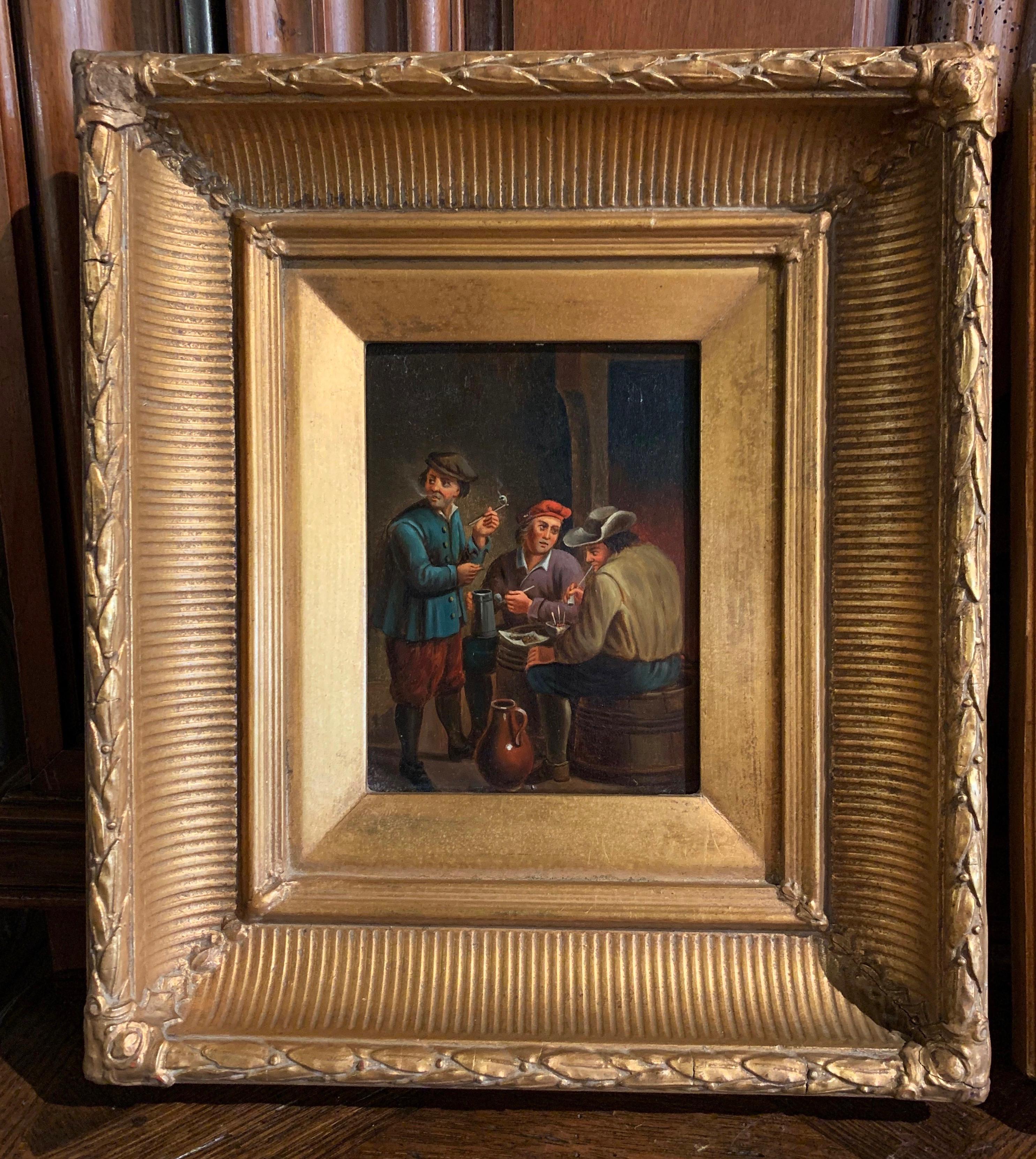 Decorate an office or a study with this elegant pair of antique paintings on copper. Created in Holland circa 1860 and set in their original carved gilt frames, each painting depicts a tavern scene with peasants in traditional clothing in the matter