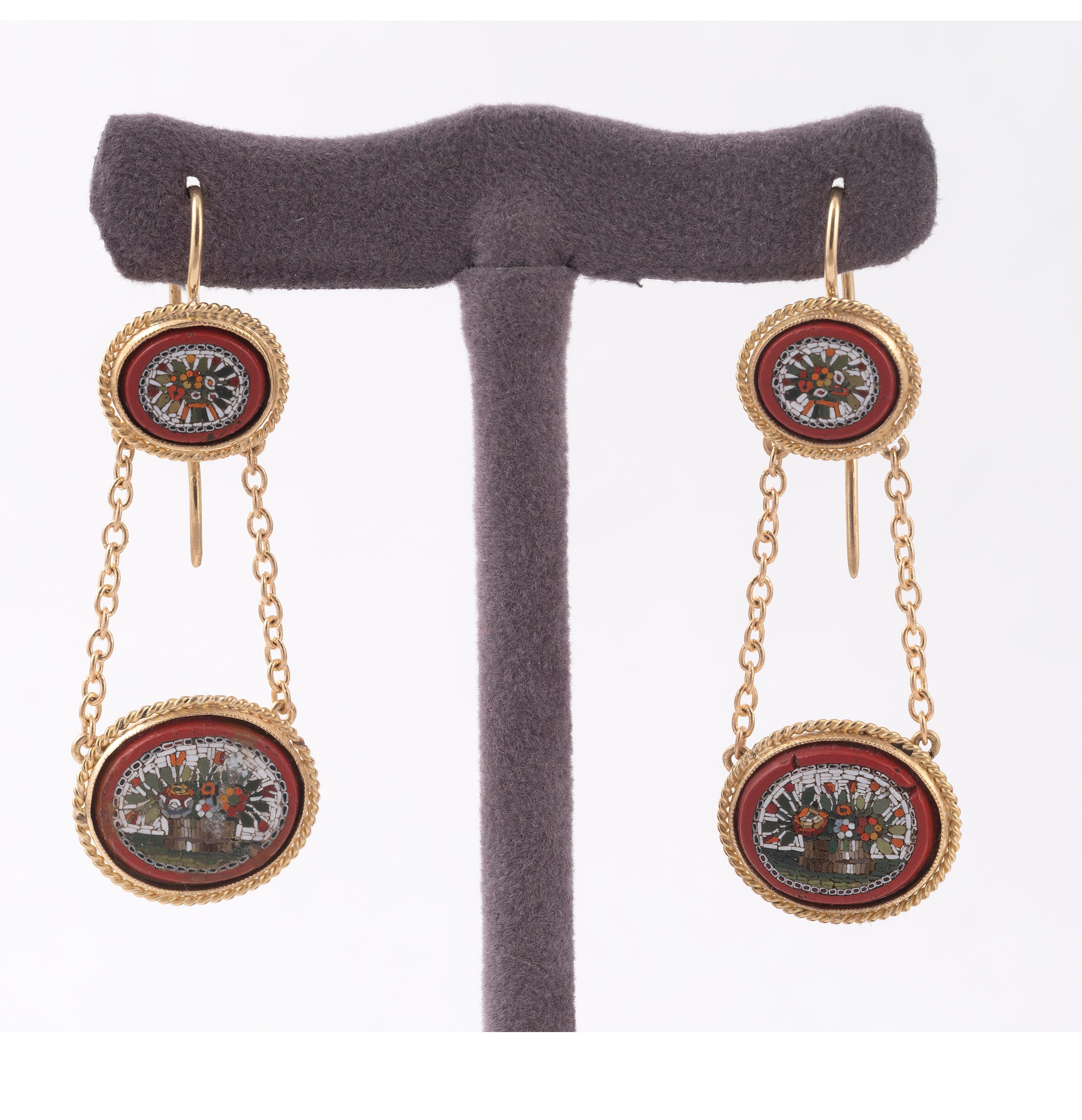 Pair of 19th century floral micromosaic and red-glass pendant earrings, Italian c.1860
with a large oval red-glass panel hung horizontally on two chain below a smaller one, each inset with a mosaic depicting a basket with flowers in full bloom,