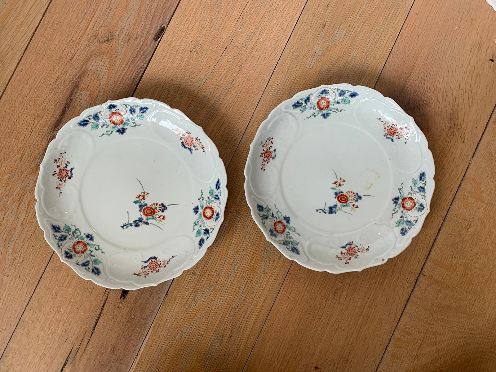 Pair of 19th century floral round porcelain plates with scalloped edge, unmarked.