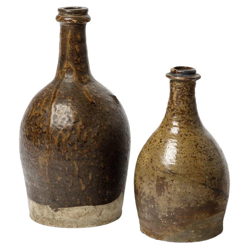 Pair of 19th century folk art stoneware ceramic bottles realised in La Borne For Sale